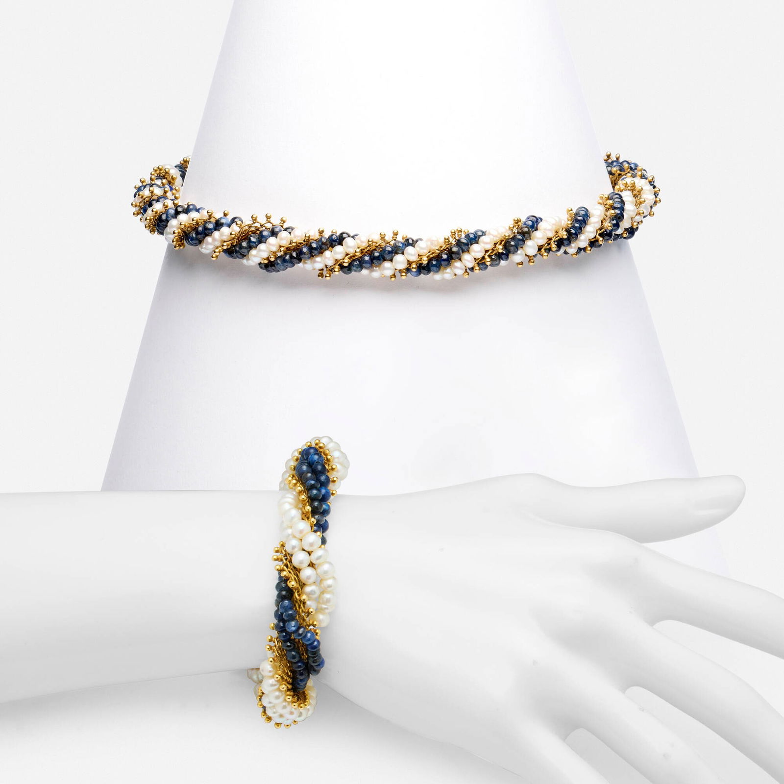 Cultured pearl, sapphire, and gold bracelet and necklace: Cultured pearl, sapphire, and gold bracelet and necklace Each a torsade of sapphire beads, cultured pearls, and beaded woven gold Yellow gold 17.25 in and 8.50 in; Gross weight 108.7 dwts This