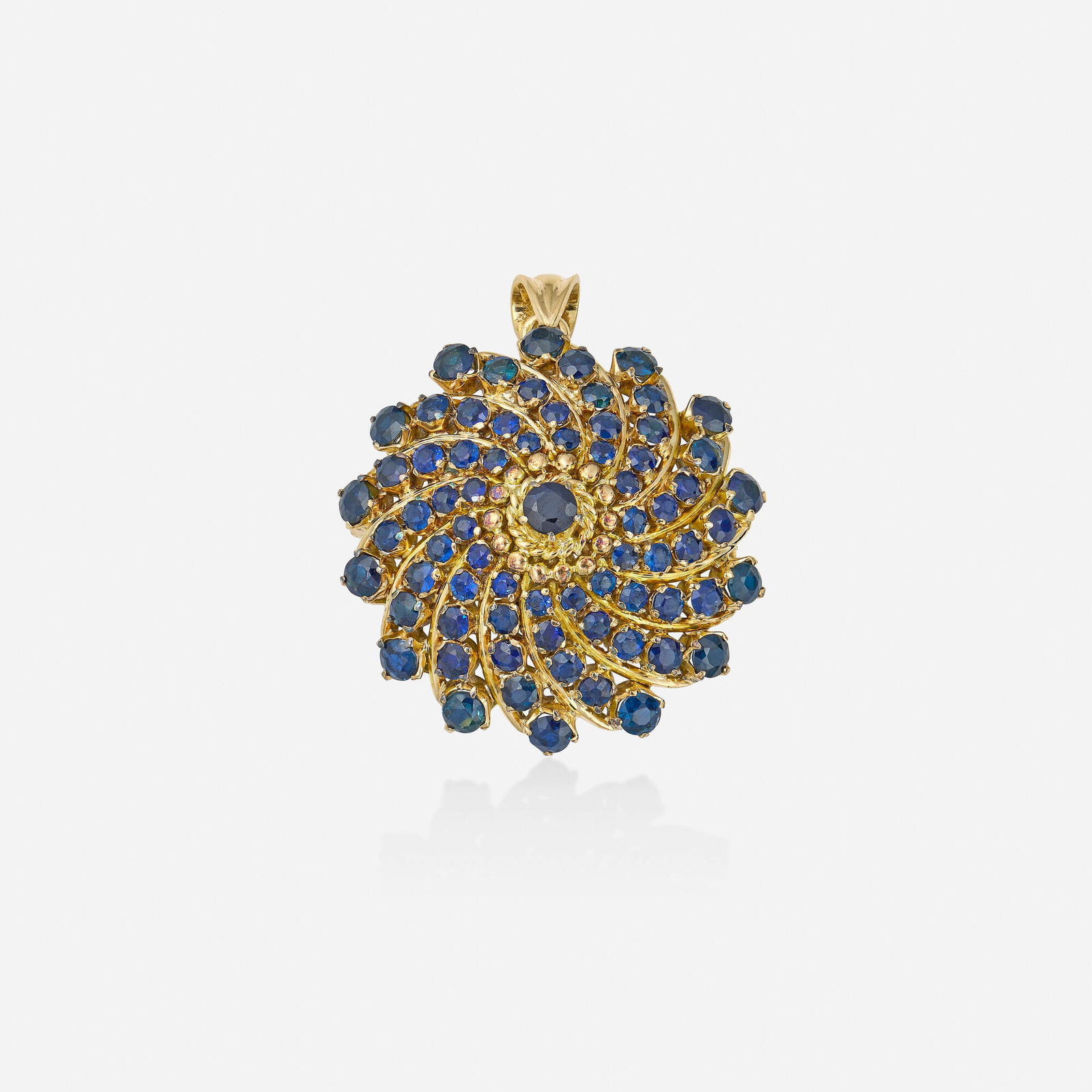 Sapphire and gold pendant brooch: Sapphire and gold pendant brooch Set with circular-cut sapphires Yellow gold 1.25 in; Gross weight 7.4 dwts This work will ship from Lambertville, New Jersey.