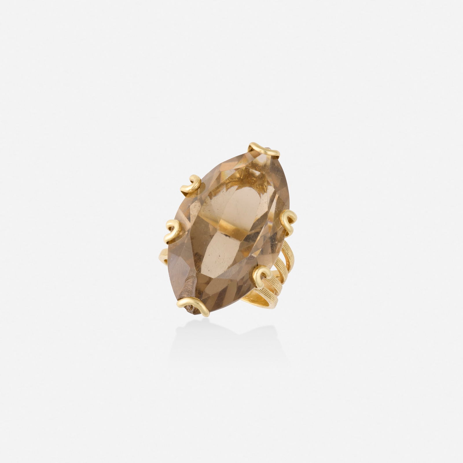 Smoky quartz and gold ring: Smoky quartz and gold ring Set with a marquise-cut smoky quartz Yellow gold Ring size 5.50; Gross weight 6.6 dwts This work will ship from Lambertville, New Jersey.