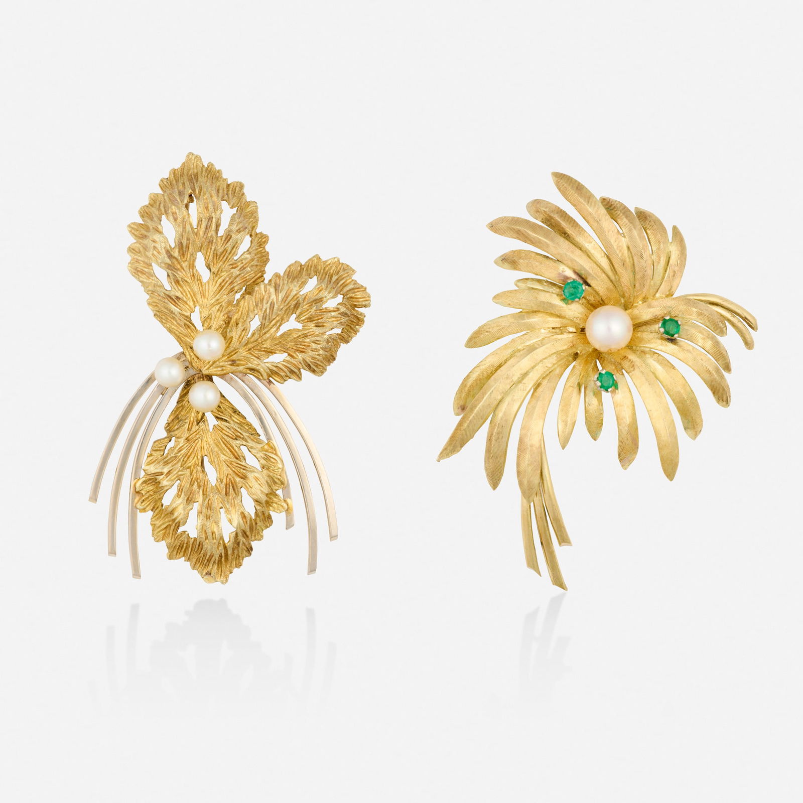 Two cultured pearl and gold pendant brooches: Two cultured pearl and gold pendant brooches Each of spray design set with cultured pearls, one further set with circular-cut emeralds 14k yellow and white gold 2.25 x 1.50 in and 2.125 x 1.625 in;