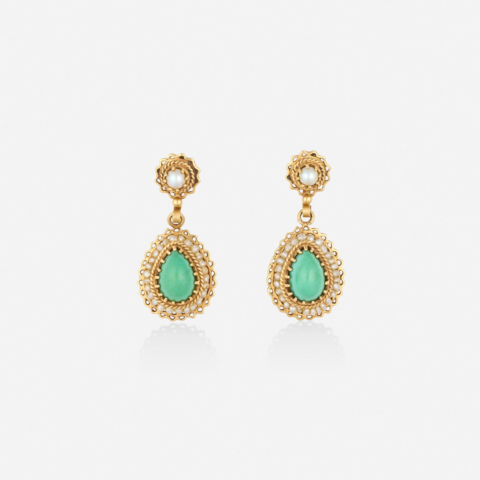 Turquoise, seed pearl, and gold earrings: Turquoise, seed pearl, and gold earrings Each set with a cabochon turquoise and seed pearls 14k yellow gold 1.25 x 0.50 in; Gross weight 5.3 dwts This work will ship from Lambertville, New Jersey.