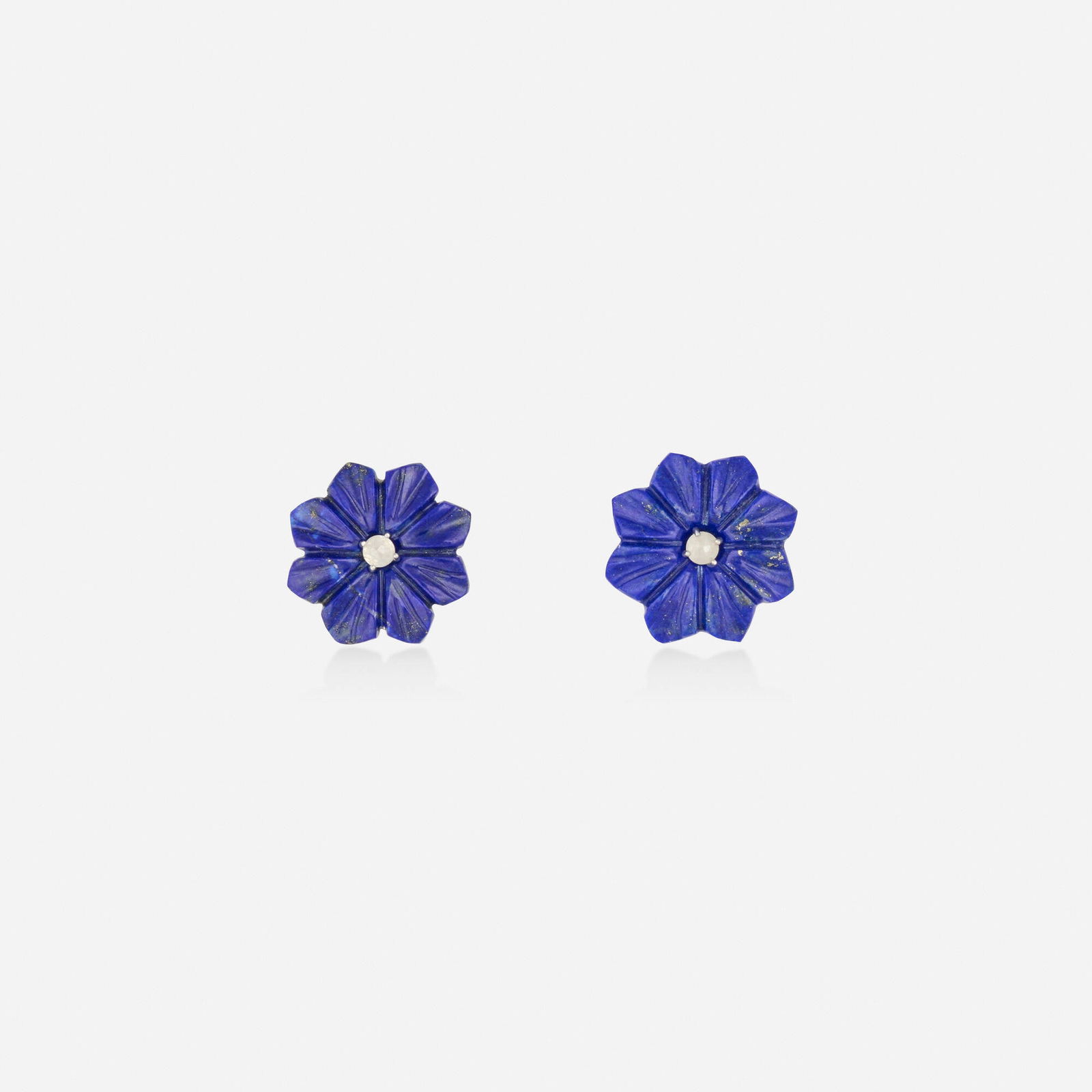 Lapis lazuli and diamond earrings: Lapis lazuli and diamond earrings Each set with a carved lapis lazuli flower with rose-cut diamond center Silver and yellow gold 0.625 in; Gross weight 2.9 dwts This work will ship from Lambertville,