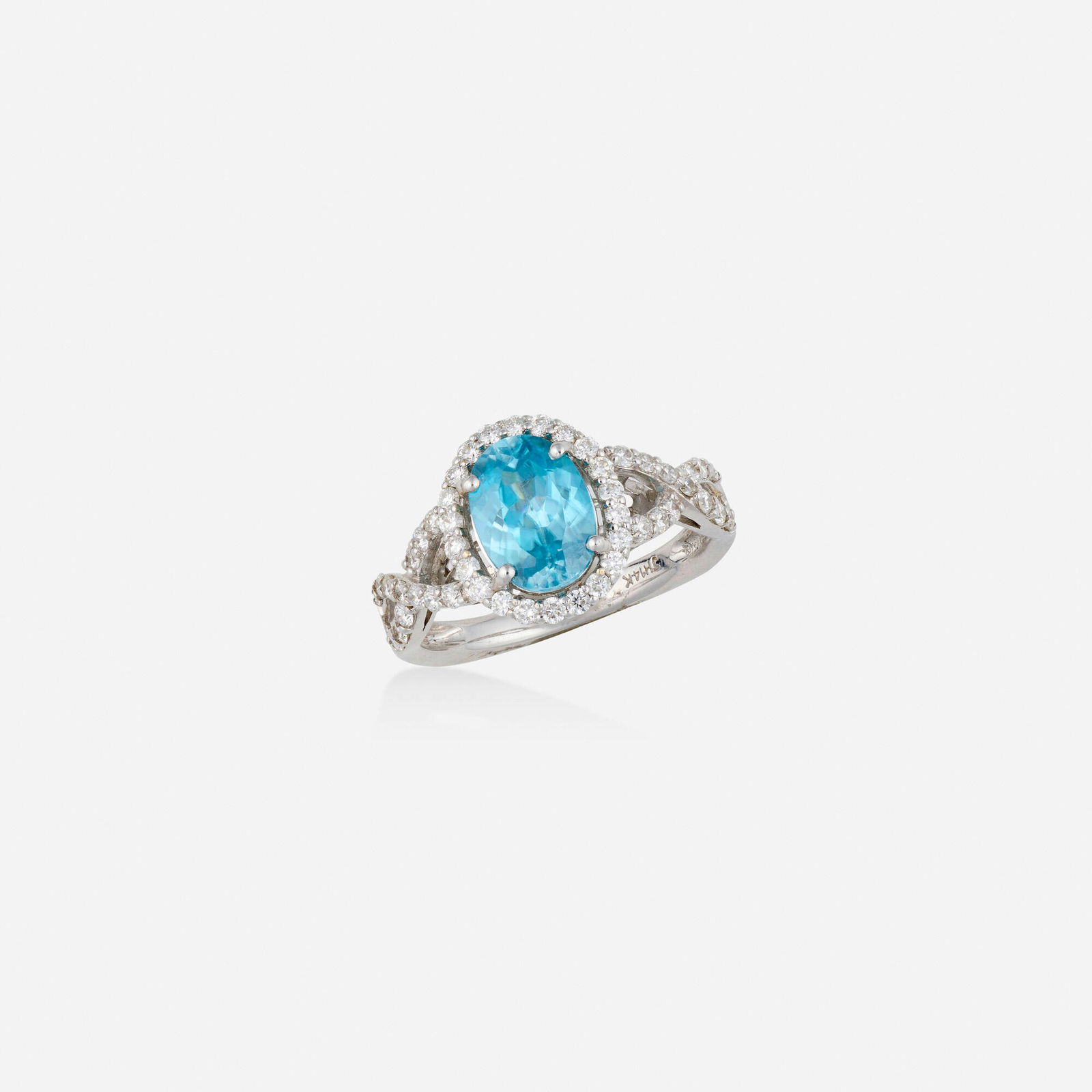 Blue zircon, diamond, and white gold ring: Blue zircon, diamond, and white gold ring Set with an oval-cut blue zircon and round brilliant-cut diamonds 14k white gold Ring size 7; Gross weight 2.5 dwts This work will ship from