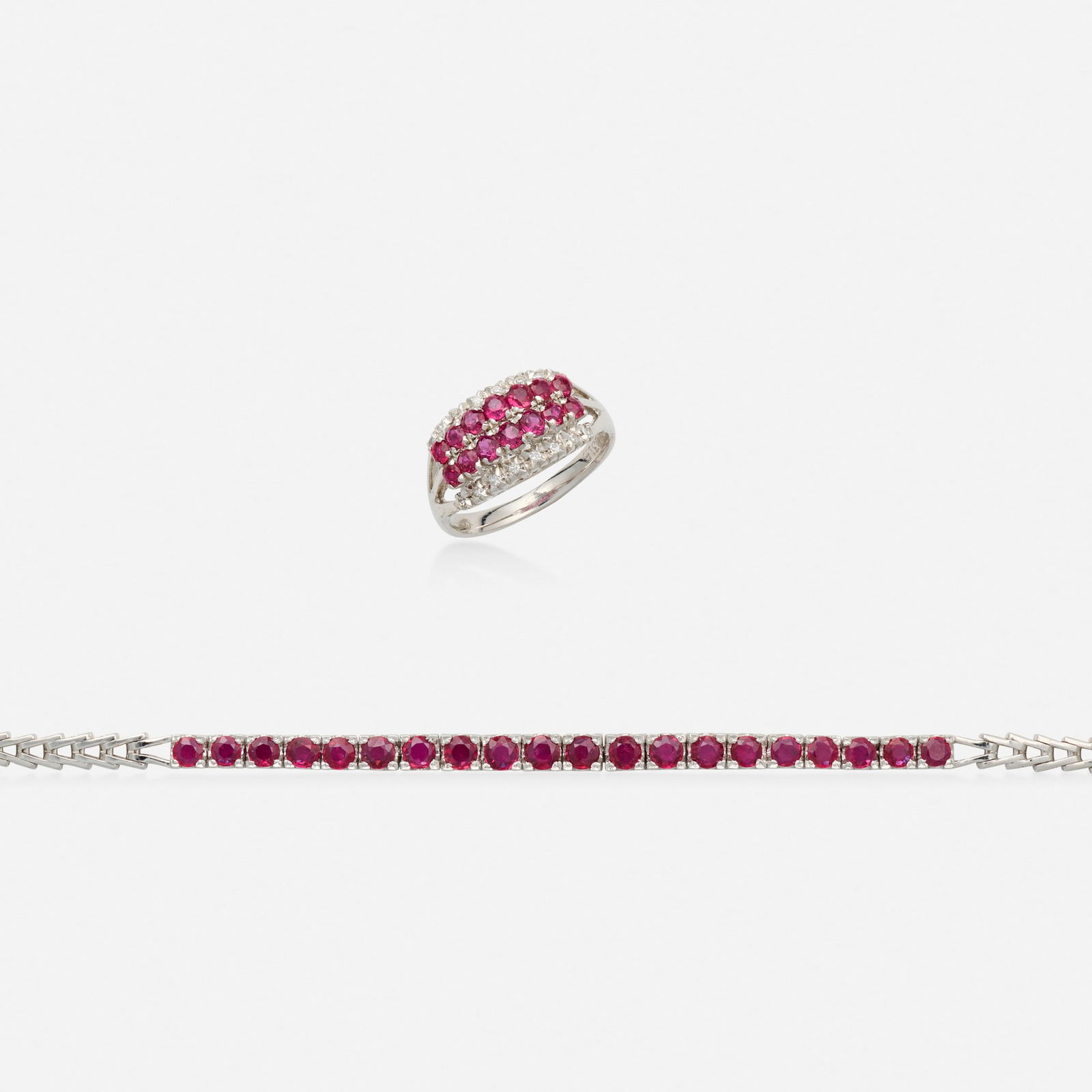 Group of ruby, diamond, and white gold jewelry: Group of ruby, diamond, and white gold jewelry Comprising a ring and bracelet each set with circular-cut rubies, the ring further set with single-cut diamonds 14k white gold Bracelet 6.75 x 0.125