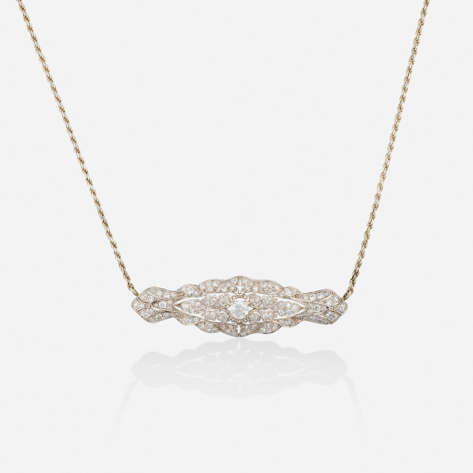 Diamond, platinum, and sterling silver necklace: Diamond, platinum, and sterling silver necklace The pendant set with old European and single-cut diamonds, joined by a roped chain Platinum and sterling silver Necklace 16.25 in, 14.25 in, pendant
