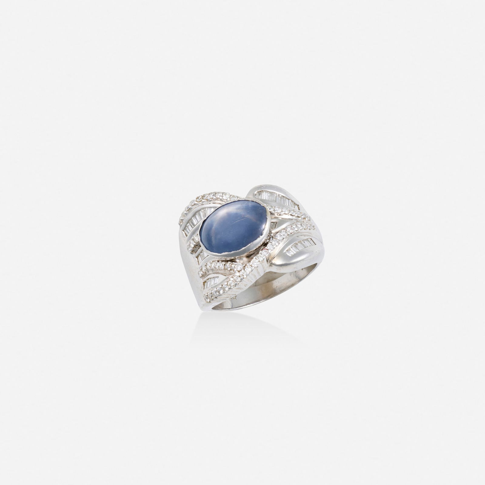 Star sapphire, diamond, and white gold ring: Star sapphire, diamond, and white gold ring Set with a cabochon star sapphire, baguette and round brilliant-cut diamonds14k white gold Ring size 8; Gross weight 7.1 dwts This work will ship from