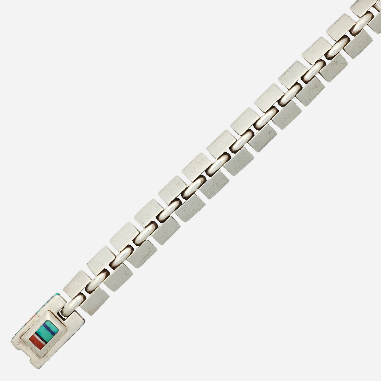 Jimmie King, Jr., Hardstone and sterling silver bracelet: Jimmie King, Jr. Hardstone and sterling silver bracelet Composed of silver fancy links, the clasp inlaid with turquoise, lapis lazuli, coral, black onyx, and white hardstone Sterling silver Signed Han