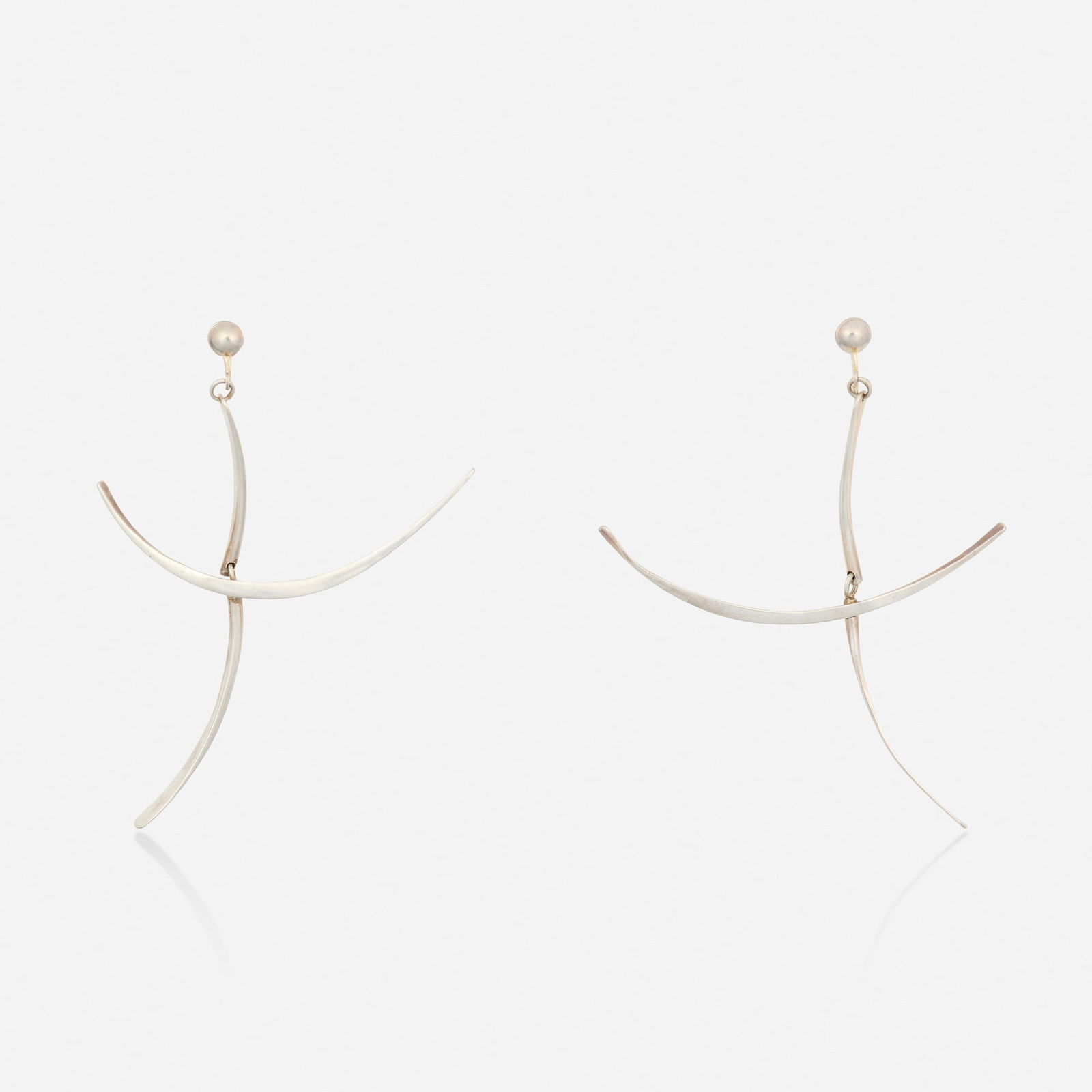 Silver earrings: Silver earrings Of sculptural design Silver 3.50 x 2.50 in; Gross weight 9.0 dwts Provenance: Collection of William and Evelyn Rakower This work will ship from Lambertville, New Je