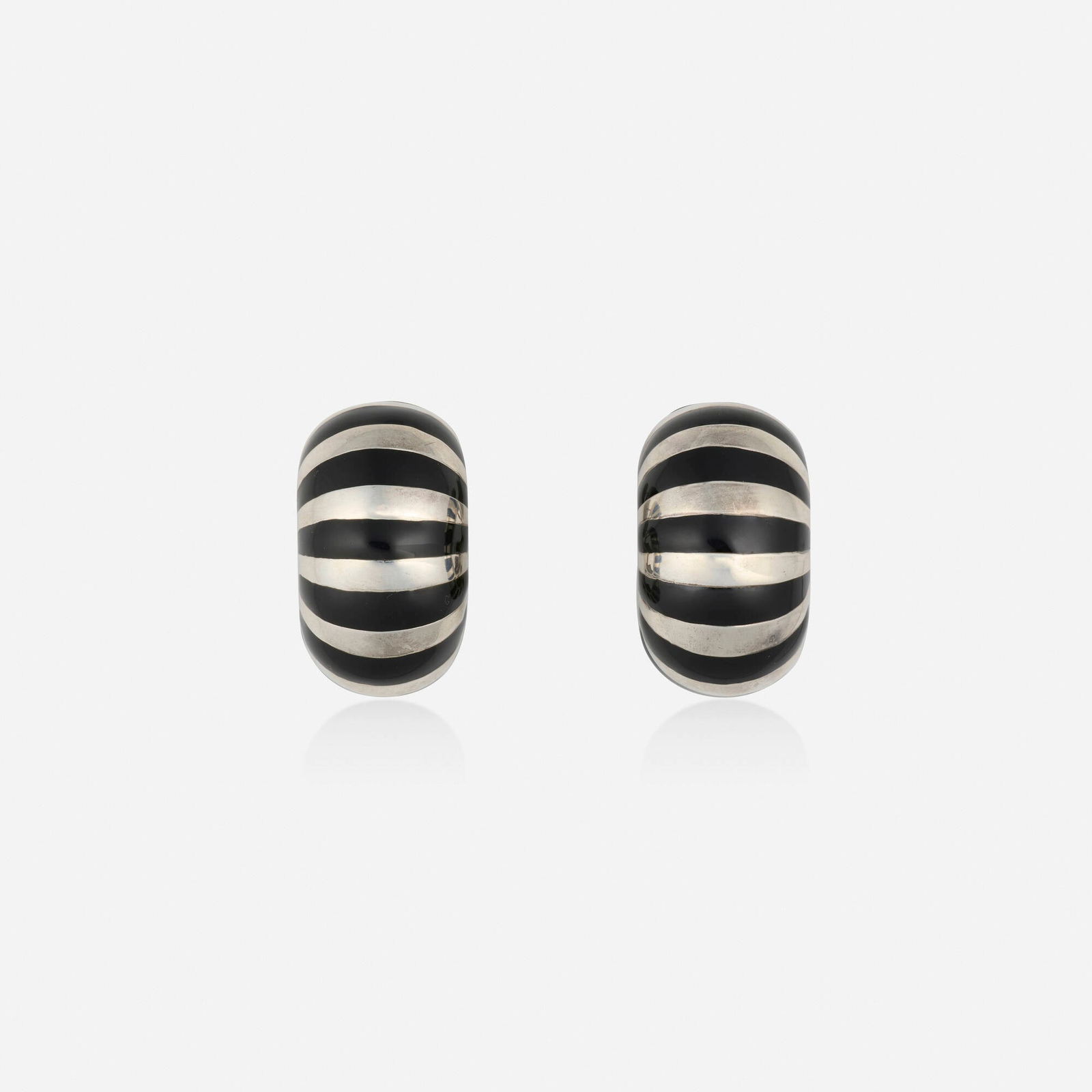 Tiffany & Co., Enamel and sterling silver earrings: Tiffany & Co. Enamel and sterling silver earrings Each with black enamel stripes Sterling silver Signed Tiffany & Co. 1 x 0.625 in; Gross weight 18.0 dwts Sold with signed box and pouch This
