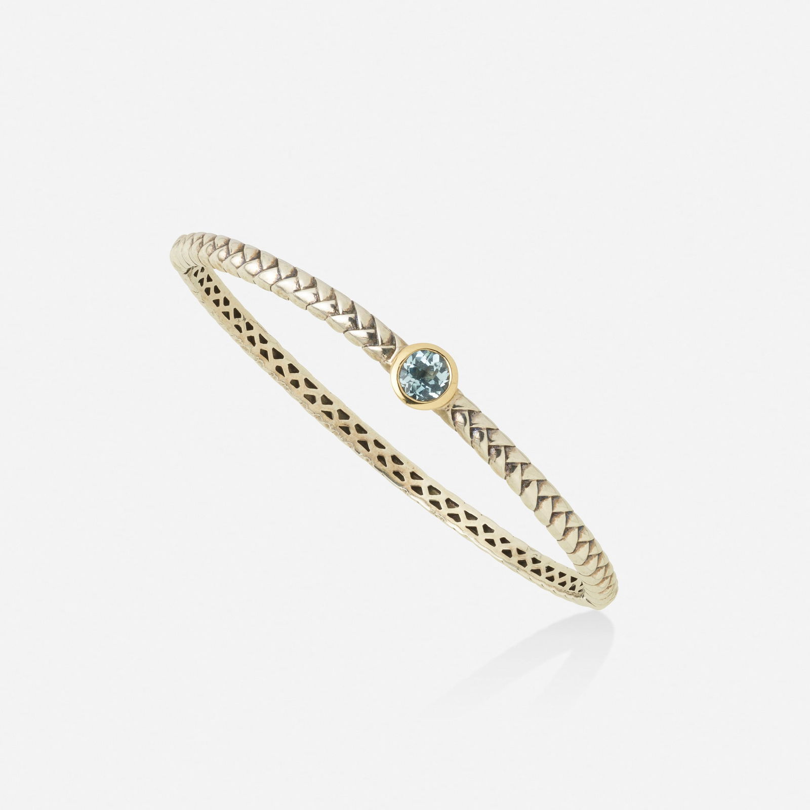 Tiffany & Co., Aquamarine, sterling silver, and gold bangle bracelet: Tiffany & Co. Aquamarine, sterling silver, and gold bangle bracelet The hinged bangle bracelet of roped sterling silver, set with a circular-cut aquamarine Sterling silver and 14k yellow gold Signed T