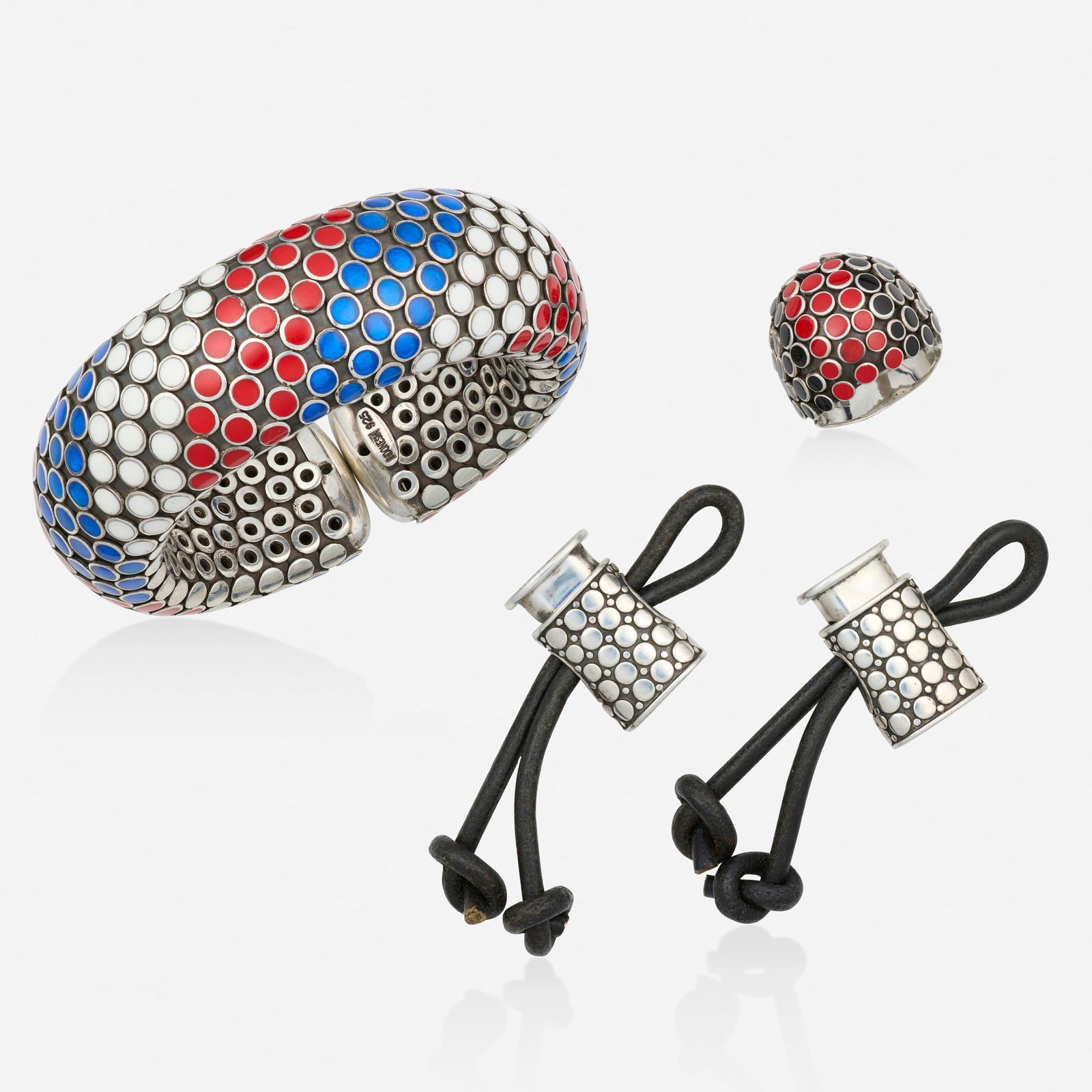 John Hardy, Group of 'Dot' sterling silver and enamel jewelry: John Hardy Group of 'Dot' sterling silver and enamel jewelry Comprising a flexible cuff bracelet of red, white, and blue enamel; a bombe ring of black and red enamel, and two toggles Sterling silver