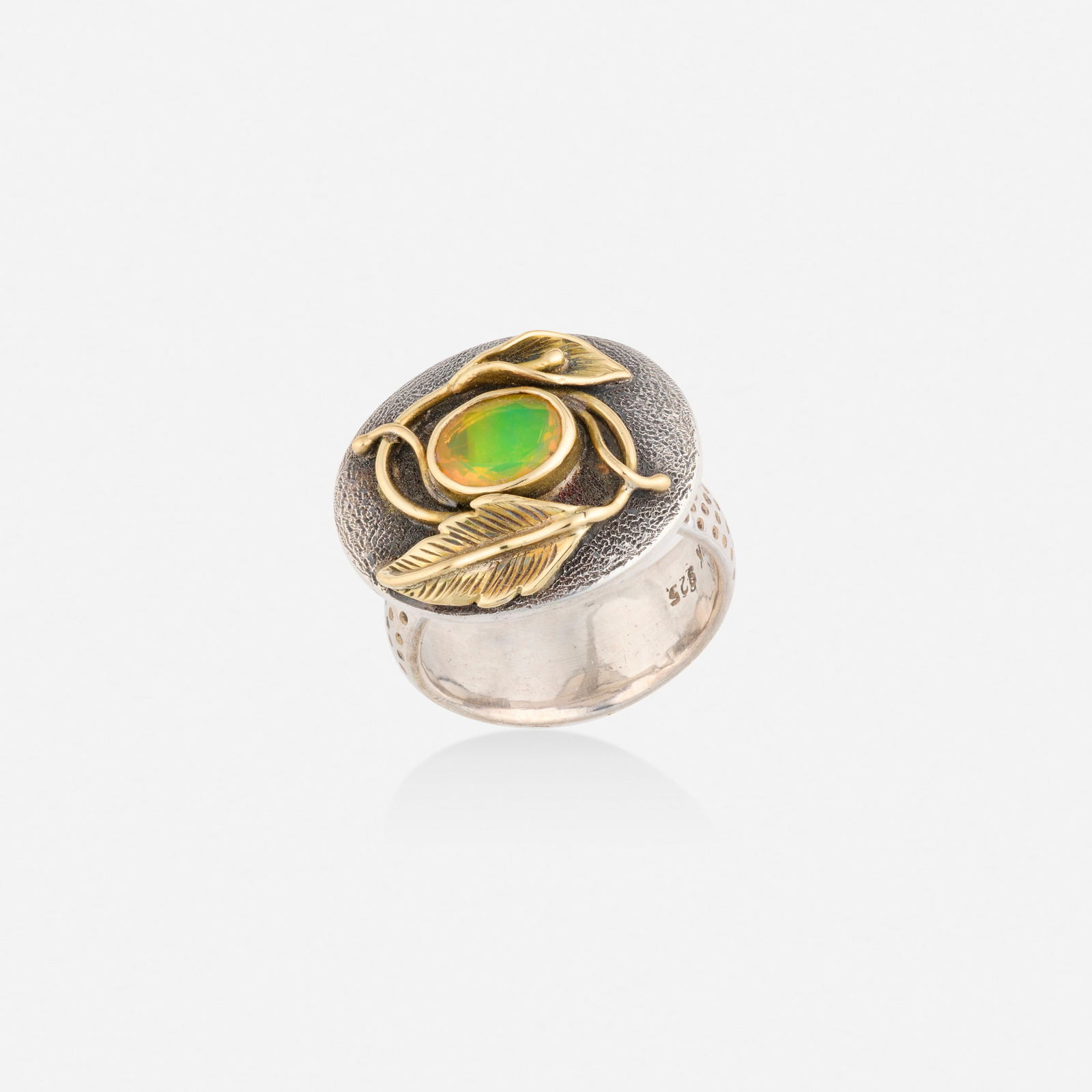 Multi-gem, silver, and gold ring: Multi-gem, silver, and gold ring Of foliate design, set with an oval-cut opal and circular-cut sapphire 18k yellow gold and sterling silver Ring size 7.50; Gross weight 7.5 dwts This work will ship fr