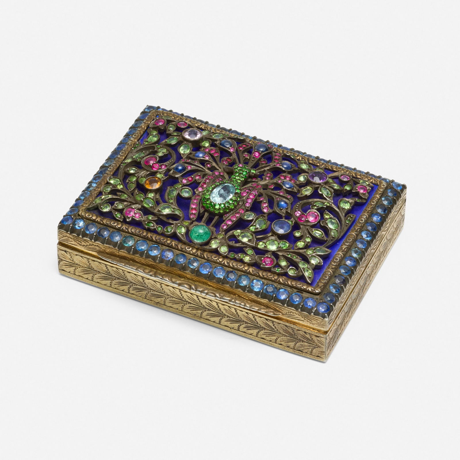 Multi-gem and silver-gilt box: Multi-gem and silver-gilt box The engraved box, the lid depicting a peacock set with circular-cut sapphire, ruby, demantoid garnet, citrine, amethyst, aquamarine, morganite and cabochon emerald and