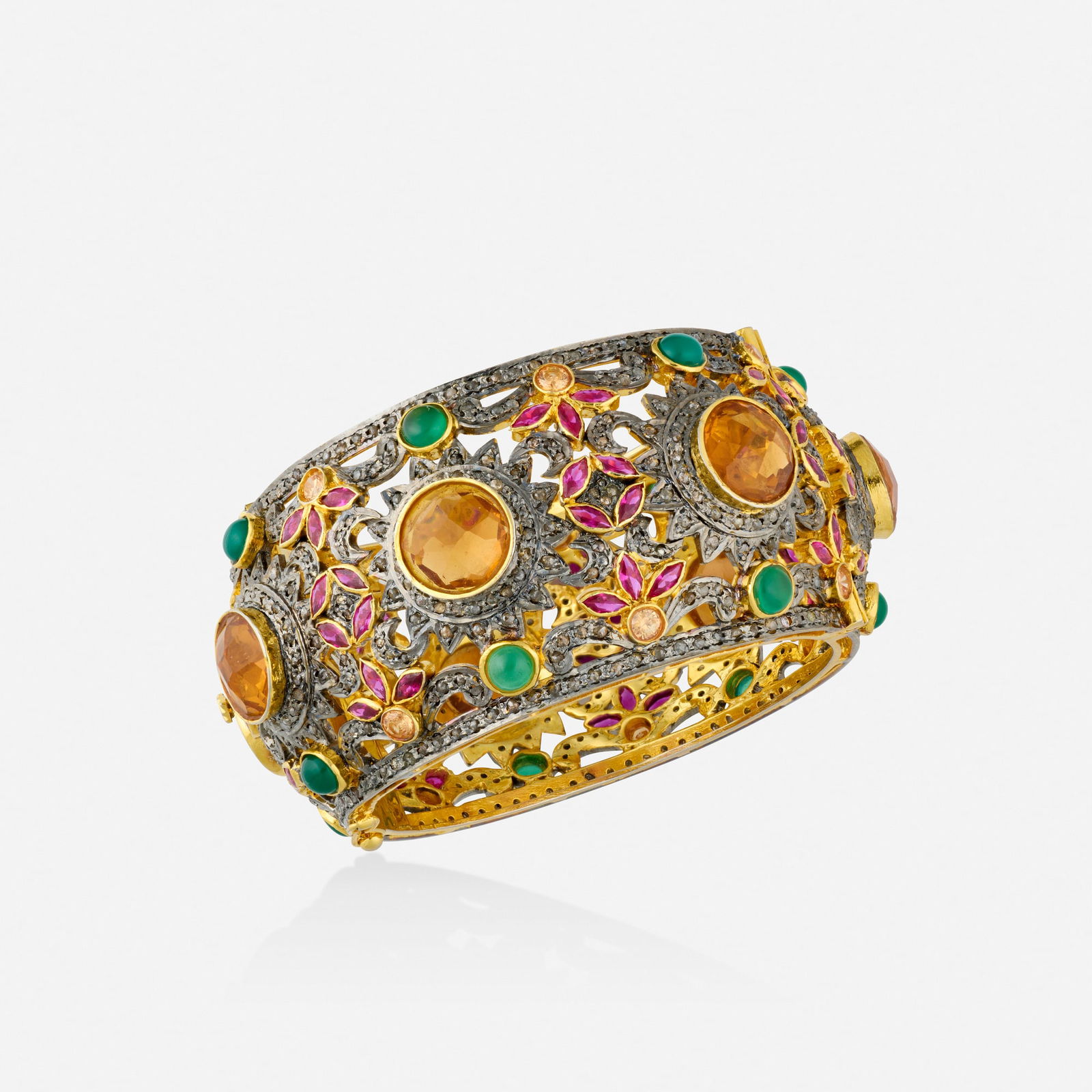 Multi-gem, diamond, and silver-gilt bracelet: Multi-gem, diamond, and silver-gilt bracelet The hinged bangle set with checkerboard-cut yellow glass, marquise-cut synthetic rubies, circular-cut glass, cabochon dyed green chalcedony, and rose-cut