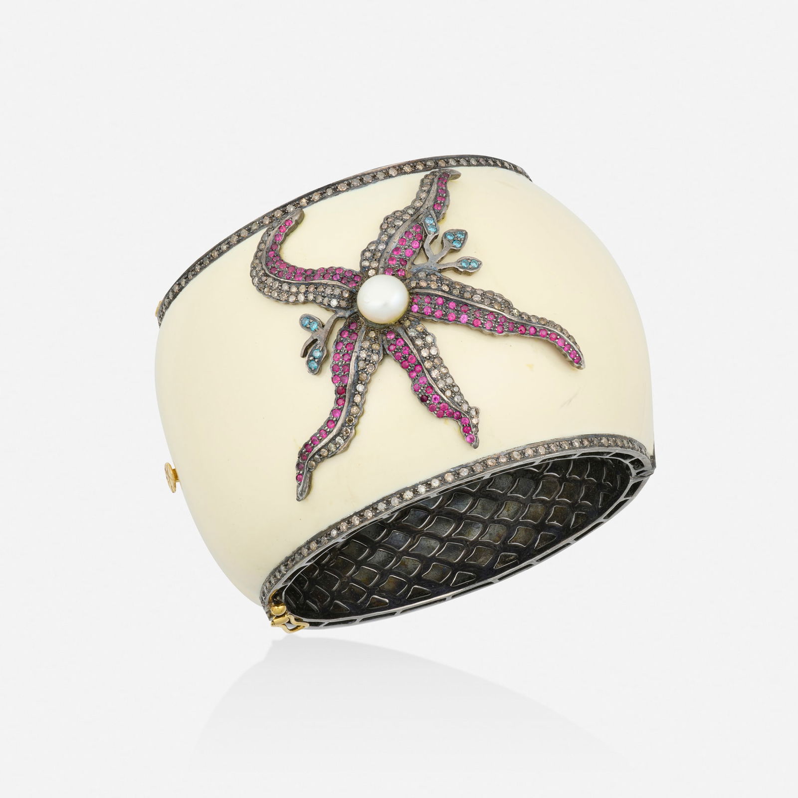 Multi-gem bracelet: Multi-gem bracelet The hinged bangle of white enamel, the starfish setting of single-cut colored diamonds, circular-cut rubies, and a cultured pearl Yellow gold and blackened silver Inner circ. 7