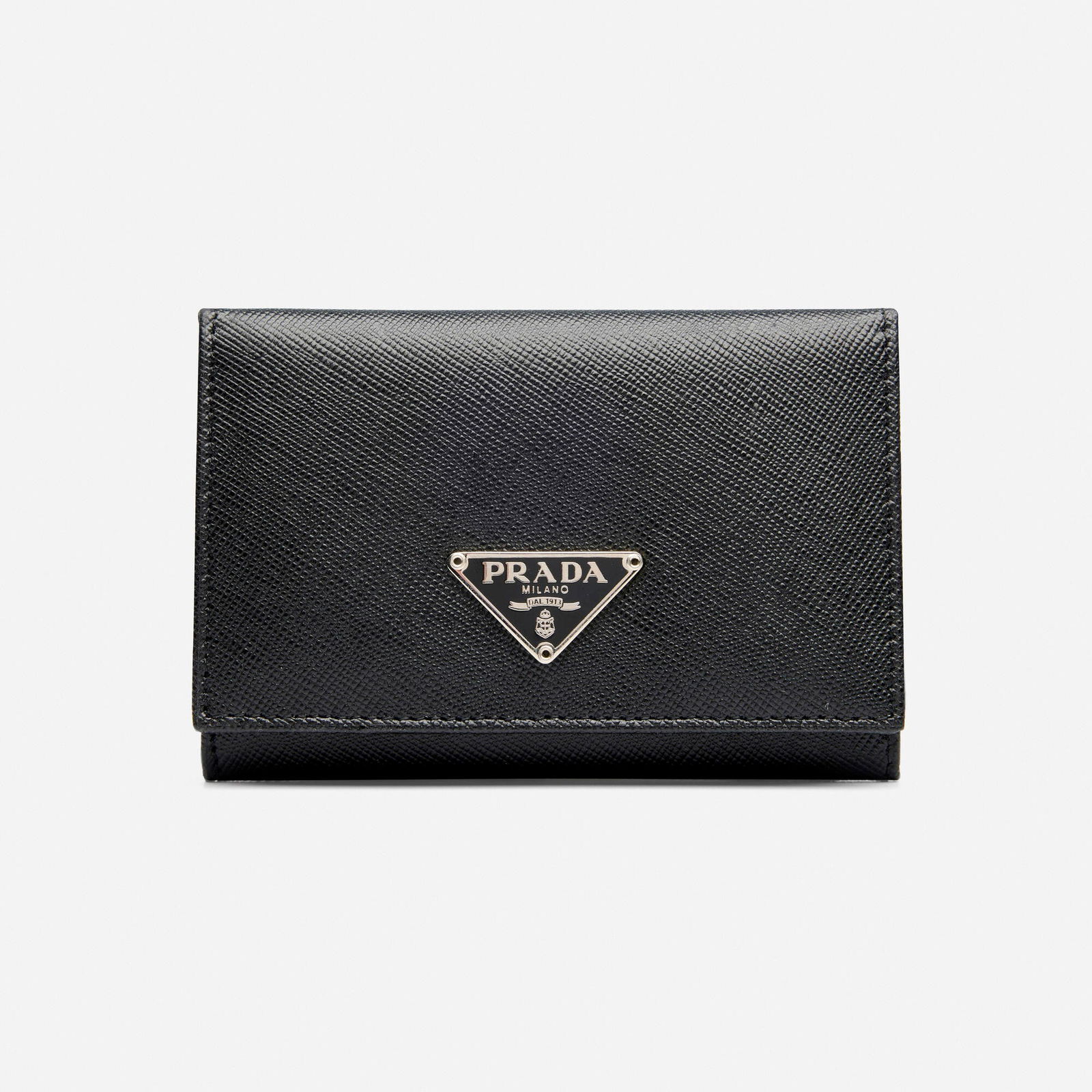 Prada, Wallet: Prada Wallet Black Saffiano leather, model M504A Leather, metal Signed Prada 4.25 x 0.75 x 3 in Sold with signed box and authenticity card This work will ship from Lambertville, New Jersey.