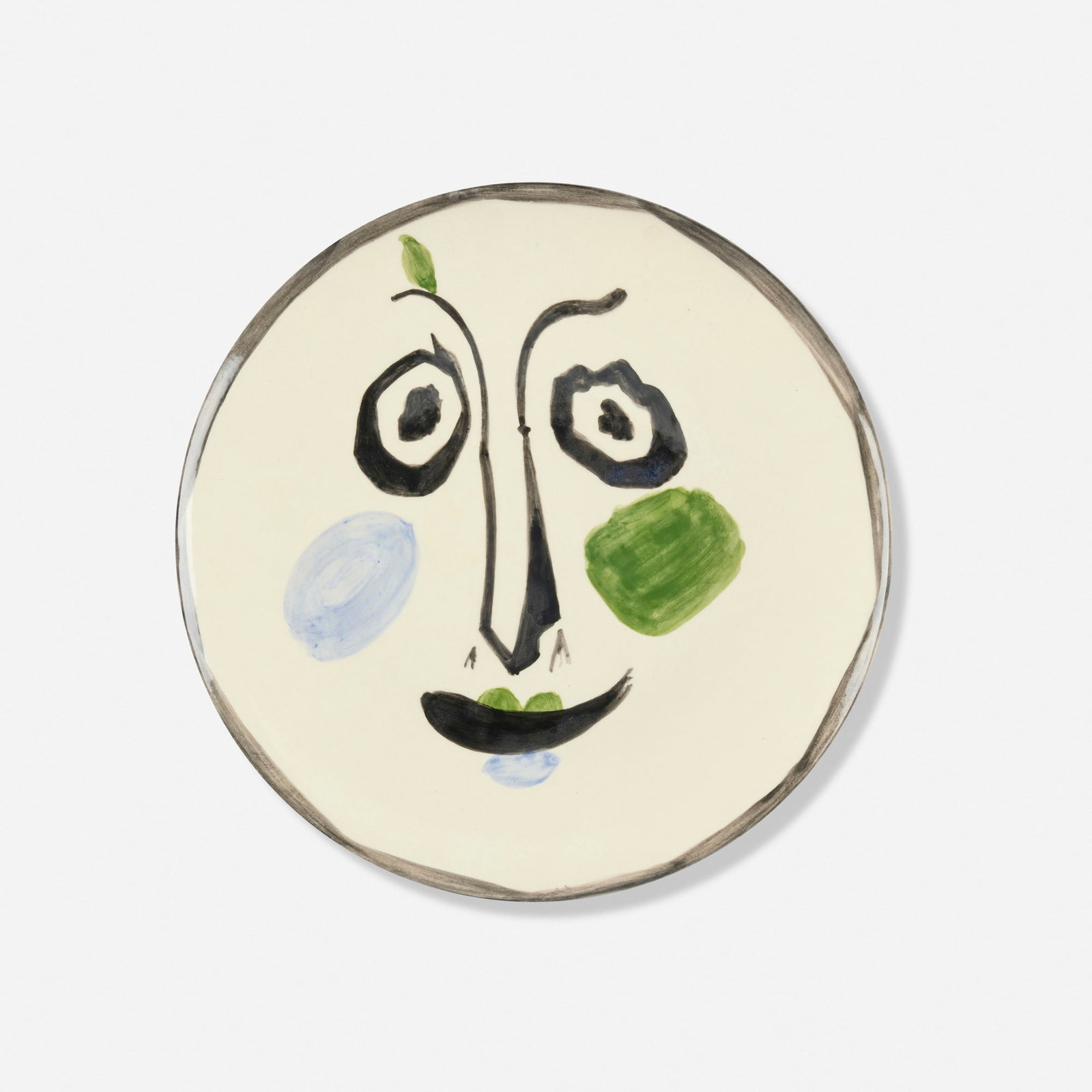 Pablo Picasso, Visage No. 197: Pablo Picasso Visage No. 197 1963white earthenware clay, decoration in engobes and enamel under glaze 0.75 h x 10 dia in (2 x 25 cm) Glazed studio marks to underside 'Edition Picasso 308/500 N