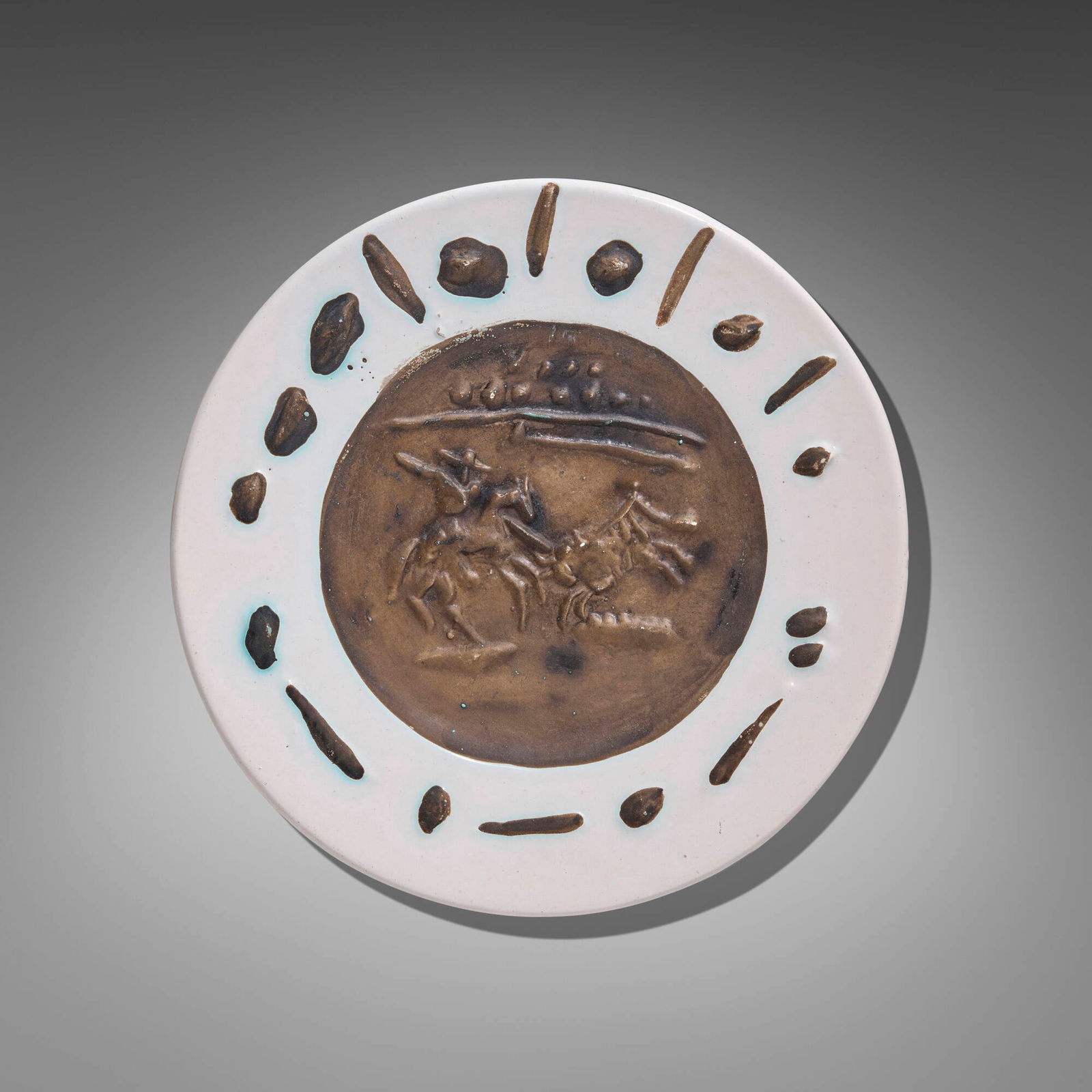 Pablo Picasso, Picador: Pablo Picasso Picador 1953white earthenware with oxidized paraffin 1.125 h x 9.5 dia in (3 x 24 cm) Stamped to underside 'Madoura Plein Feu Empreinte Originale de Picasso'. This is from the ed