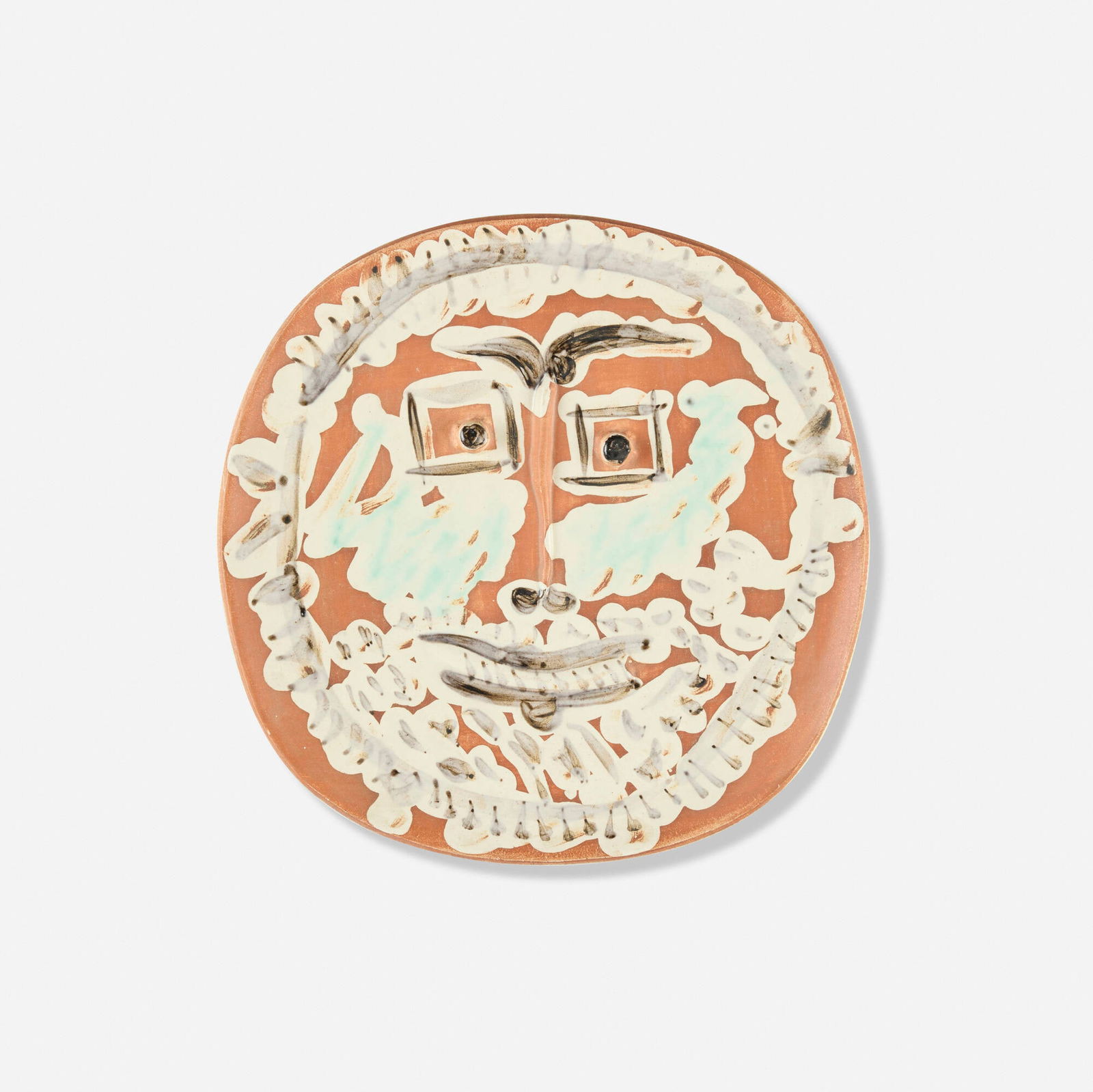 Pablo Picasso, Visage aux yeux carres: Pablo Picasso Visage aux yeux carres 1959white earthenware clay, decoration in ceramic pastel crayons, engobe under partial brushed glaze, red patina ivory, green, black 1.125 h x 9.75 w x 9.75 d in