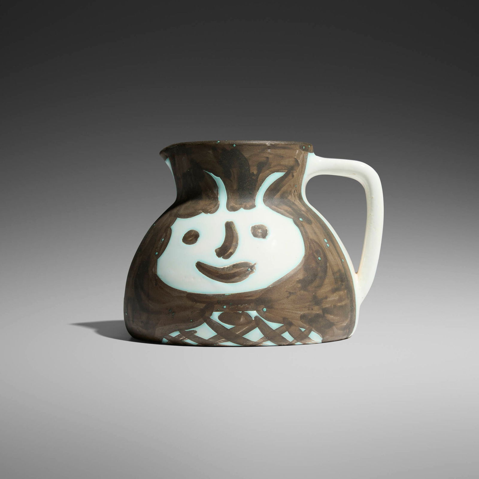 Pablo Picasso, Tetes: Pablo Picasso Tetes 1956white earthenware with oxidized paraffin decoration and white enamel 5 h x 6 w x 6 d in (13 x 15 x 15 cm) Impressed studio marks to underside 'Edition Picasso' and 'Mad