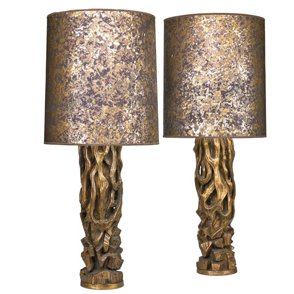 JAMES MONT Pr. of tree trunk table lamps: JAMES MONT (1904 - 1974) JAMES MONT DESIGN Pair of tree trunk table lamps, New York, 1950s; Carved, gilt, and polychromed wood, painted shades, single sockets; Unmarked; Overall: 44" x 18" dia., base 