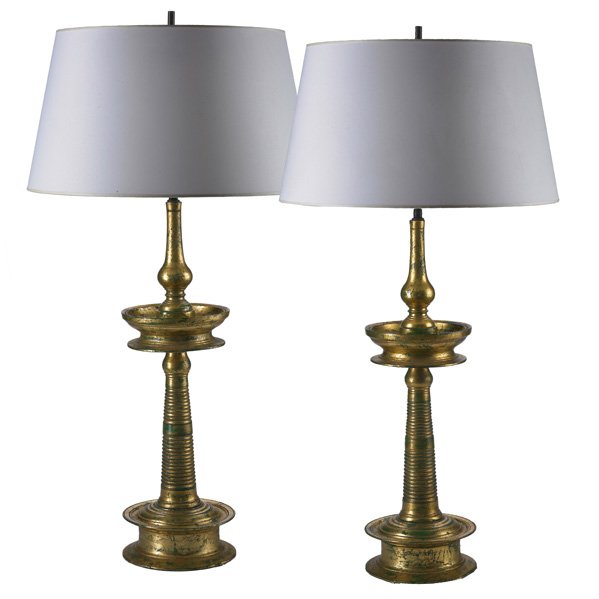 JAMES MONT; JAMES MONT DESIGN Pr. of table lamps: JAMES MONT (1904 - 1974) JAMES MONT DESIGN Pair of table lamps, New York, 1950s; Turned and gilded wood, paper shades, two sockets, patinated metal; Unmarked; Overall: 37" x 19" dia.