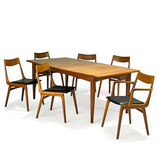 ERIK CHRISTENSEN Dining table and six chairs: ERIK CHRISTENSEN SLAGELSE MOBELVAERK A/S Extension dining table and six Boomerang chairs, one arm-, five side-, Denmark, 1960s; Sculpted teak, vinyl; Two chairs with manufacturer's labels; Table: 29"