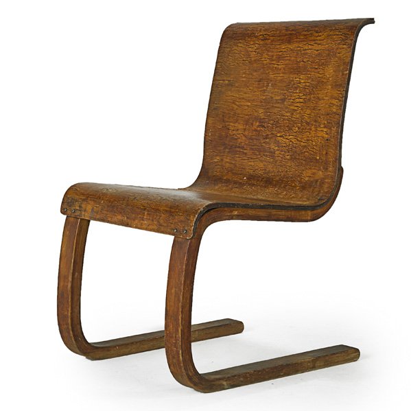 ALVAR AALTO; FINMAR Cantilever chair (no. 21): ALVAR AALTO (1898 - 1976) FINMAR Cantilever chair (no. 21), Finland, 1930s; Laminated curly birch; Illegible ink stamp; 32 1/2" x 19" x 24"