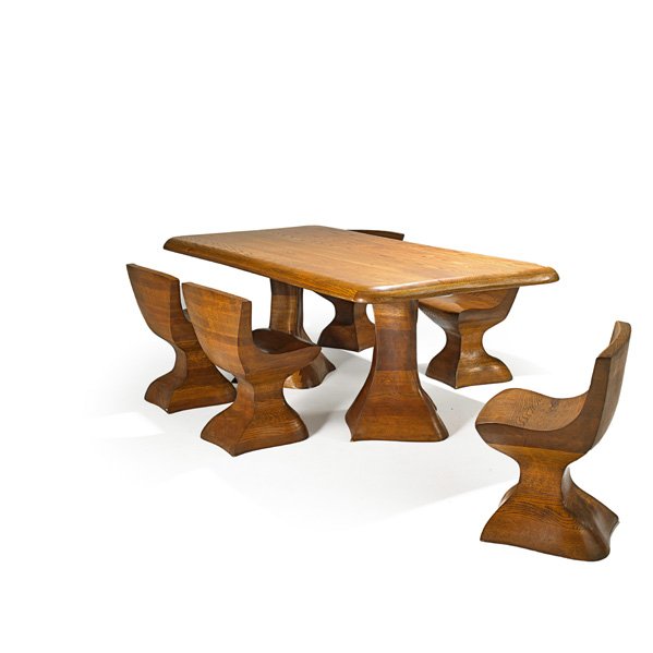 AMERICAN Dining table and five chairs: AMERICAN Dining table and five chairs, USA, 1980s; Laminated and carved oak; Unmarked; Chairs: 28 1/2" x 22 1/2" x 18", table: 31" x 43 1/2" x 83 1/2"