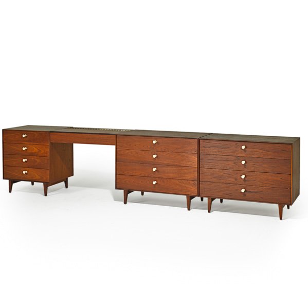 GEORGE NELSON; HERMAN MILLER Suite: GEORGE NELSON (1908 - 1986) HERMAN MILLER Thin-Edge bedroom suite with illuminated vanity, Zeeland, MI, 1950s; Teak, porcelain; Two dressers with metal labels; Overall: 27 3/4" x 18 1/2" x 122 1/4", s