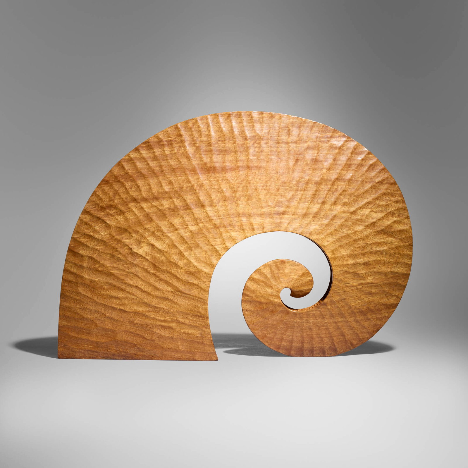 Ben Trupperbaumer, Nautilus: Ben Trupperbaumer Nautilus 1997 cedar 18.25 h x 27 w x 4 d in (46 x 69 x 10 cm) Incised signature and date to underside 'Ben T. '97'. Provenance: del Mano Gallery, Los Angeles | Collection of