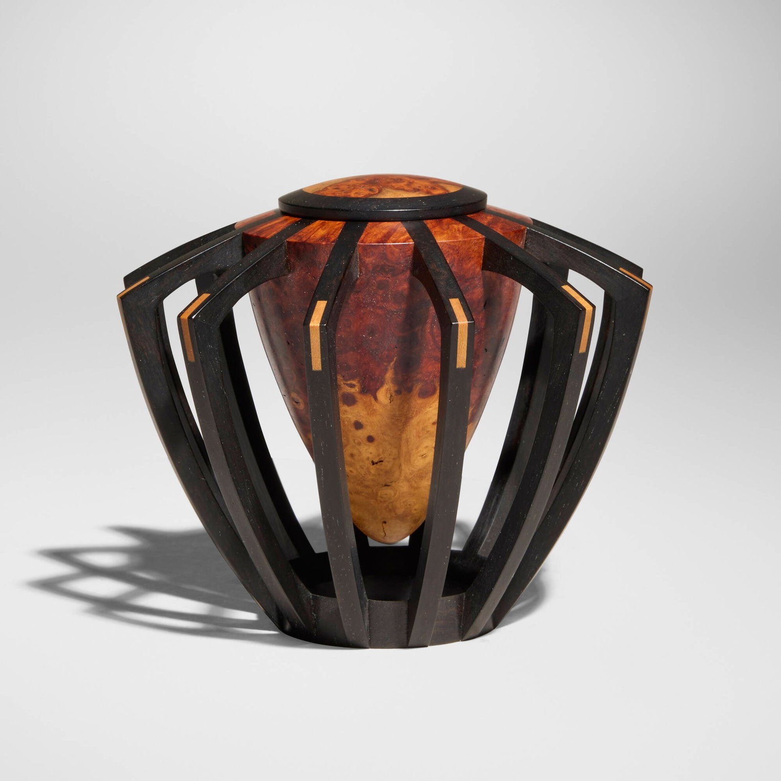 Mark Nantz, Exoskeleton: Mark Nantz Exoskeleton 1999amboyna, ebony 3.5 h x 4.625 dia in (9 x 12 cm) Incised signature and date to underside 'M. Nantz 1-99'. Provenance: Collection of Neil and S