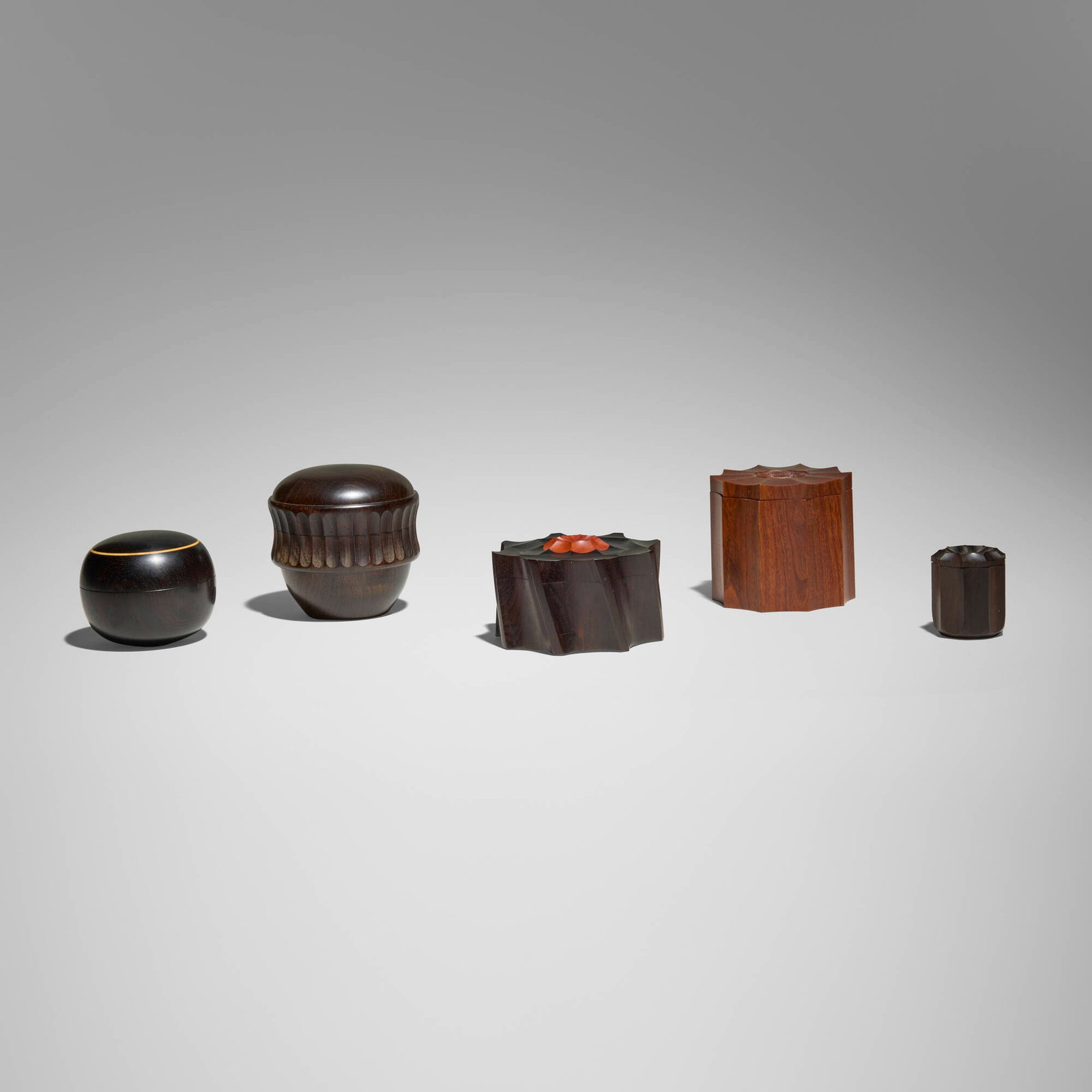 Dale Chase, Collection of five boxes: Dale Chase Collection of five boxes 1979, undatedrosewood, African blackwood, pink ivory wood, boxwood, ebony tallest: 2.875 h x 2.875 dia in (7 x 7 cm) shortest: 1.625 h x 1.375 dia in (4 x 3 cm)