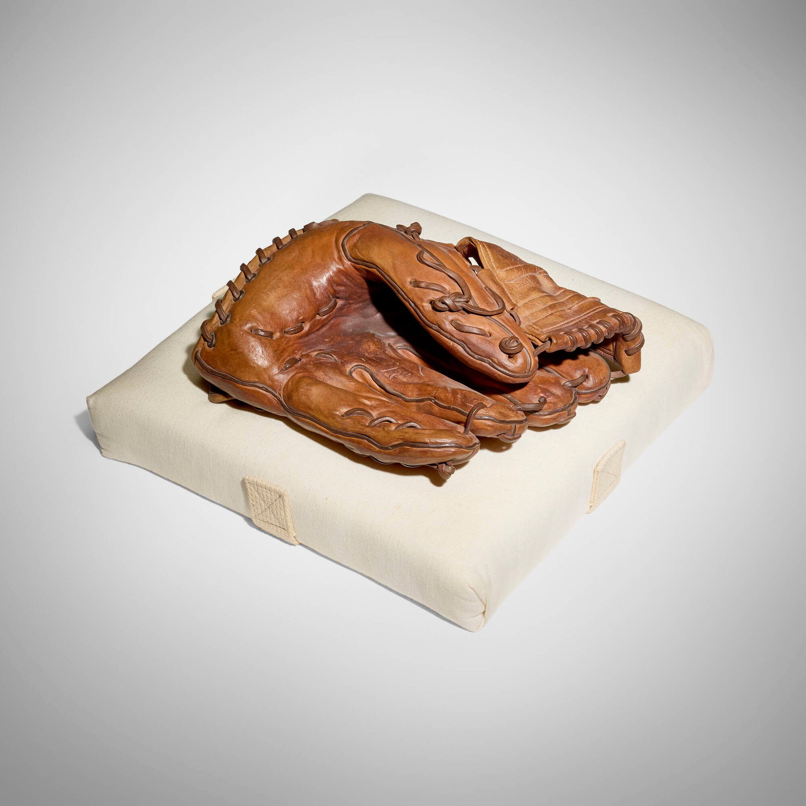 Richard Scott Newman, Untitled (Baseball Glove): Richard Scott Newman Untitled (Baseball Glove) glazed earthenware, fabric base glove: 4.5 h x 8 w x 10 d in (11 x 20 x 25 cm) base: 2.5 h x 13 w x 13 d in (6 x 33 x 33 cm) Incised signature to