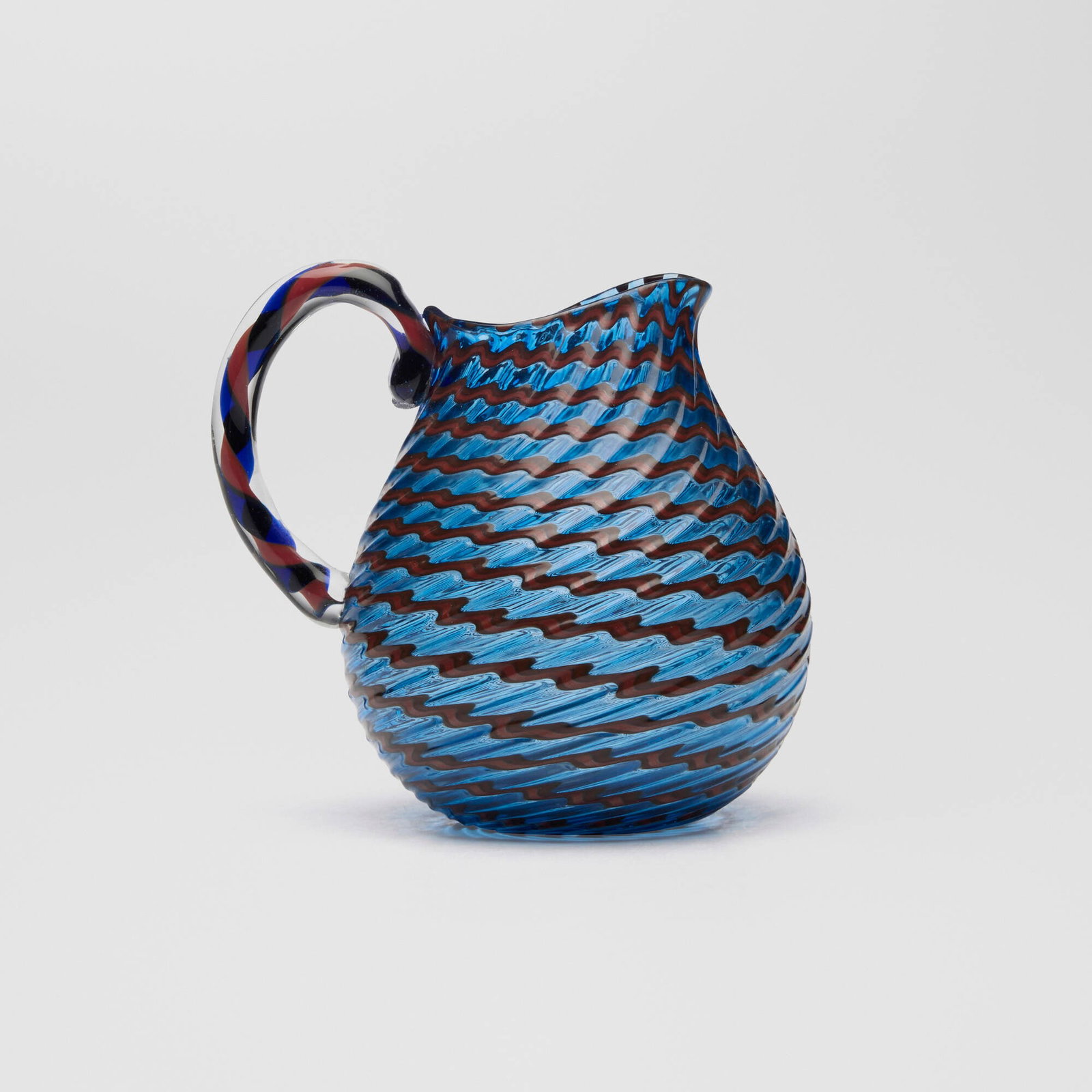 Lino Tagliapietra, Small pitcher: Lino Tagliapietra Small pitcher hand-blown glass 3.875 h x 3.125 w x 4 d in (10 x 8 x 10 cm) Provenance: Collection of Wendy and David Ellsworth This work will ship from Lambertville, New Jersey.
