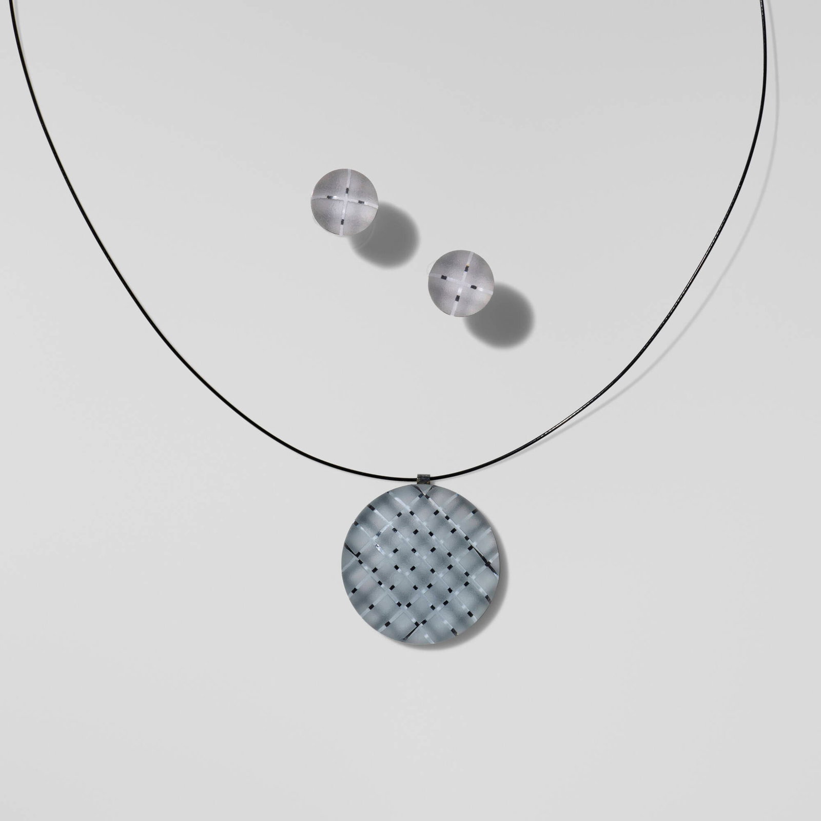 Sydney Cash, Multi-Grid pendant necklace and earrings: Sydney Cash Multi-Grid pendant necklace and earrings 2011 etched glass, silver chain: 16.5 l in (42 cm) pendant: 0.375 d x 1 dia in (1 x 3 cm) earrings: 0.25 d x 0.25 dia in (1 x 1 cm) Incised