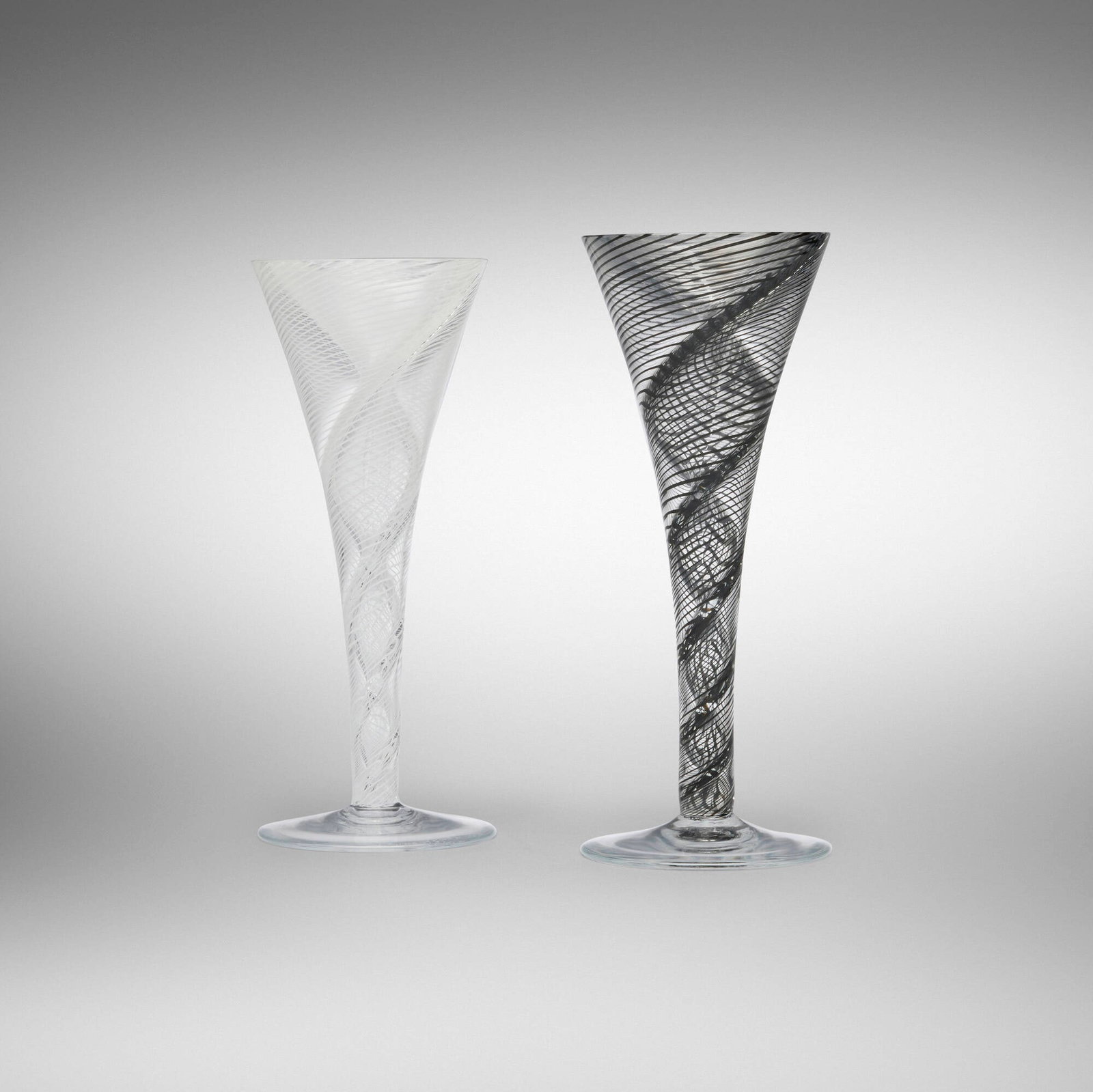 Lino Tagliapietra, Varigola vases (two works): Lino Tagliapietra Varigola vases (two works) Eos 1992 hand-blown mezza filigrana glass 8 h x 3.25 dia in (20 x 8 cm) 7.75 h x 3.25 dia in (20 x 8 cm) Etched signature, manufacturer's mark, date
