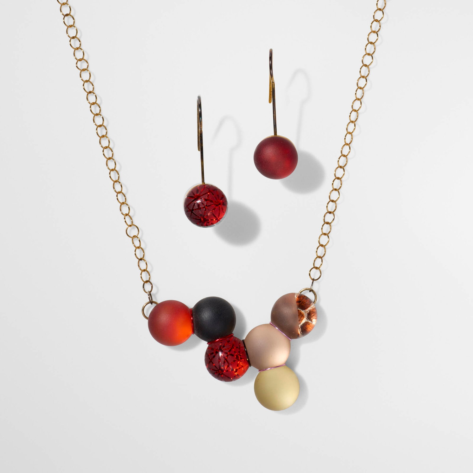 Sydney Cash, Boule necklace and earrings: Sydney Cash Boule necklace and earrings 2008 etched glass, gold plated metal chain: 15.875 l in (40 cm) pendant: 1.25 h x 1.875 w x 0.25 d in (3 x 5 x 1 cm) earrings: 1.375 h x 0.375 w x 0.25 d in