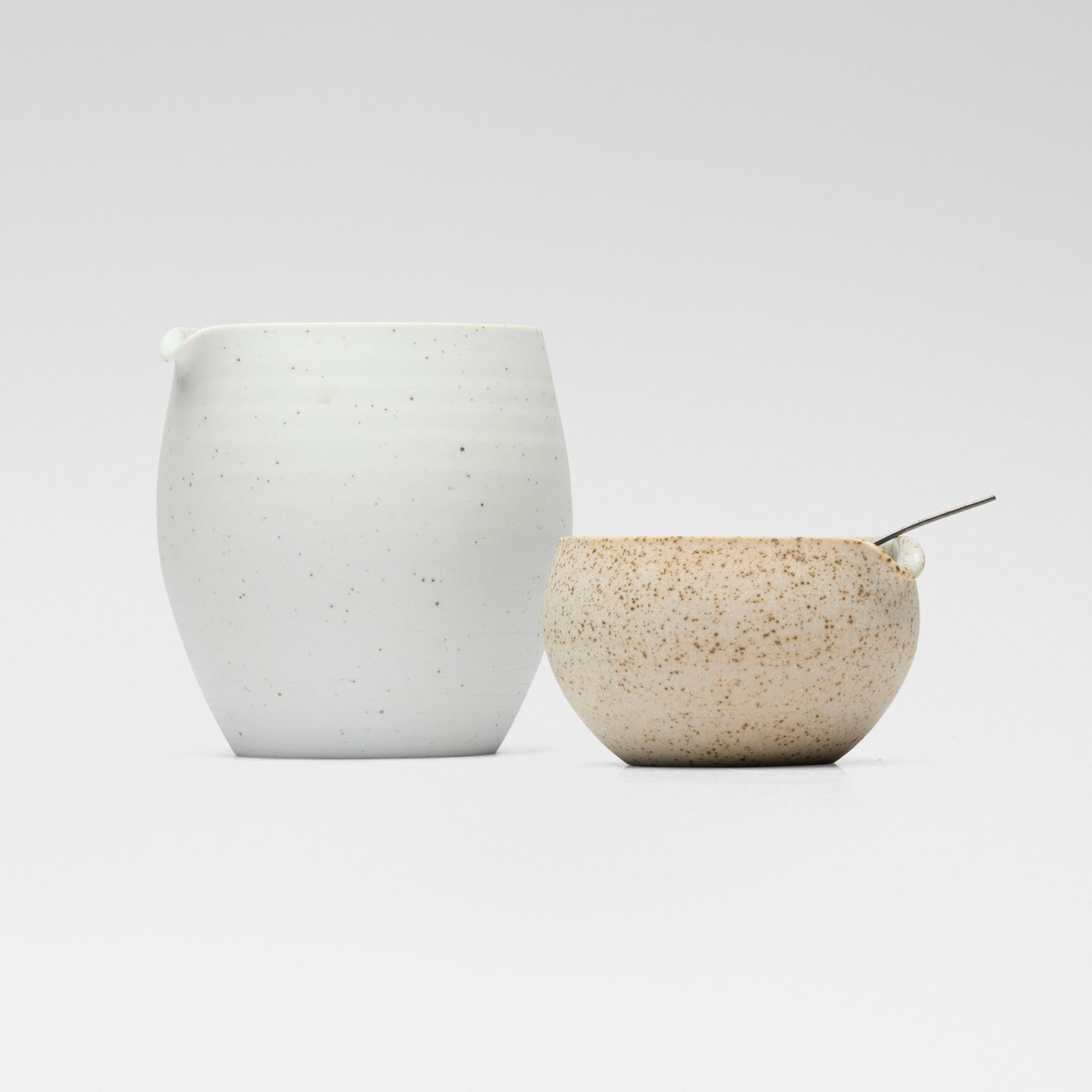 Sue Paraskeva, Pouring vessels (two works): Sue Paraskeva Pouring vessels (two works) c. 2002glazed porcelain, glazed stoneware, silver spoon: 3.375 h x 0.25 w x 0.5 d in (9 x 1 x 1 cm) 3.625 h x 3.75 w x 3.125 d in (9 x 10 x 8 cm) 1.75