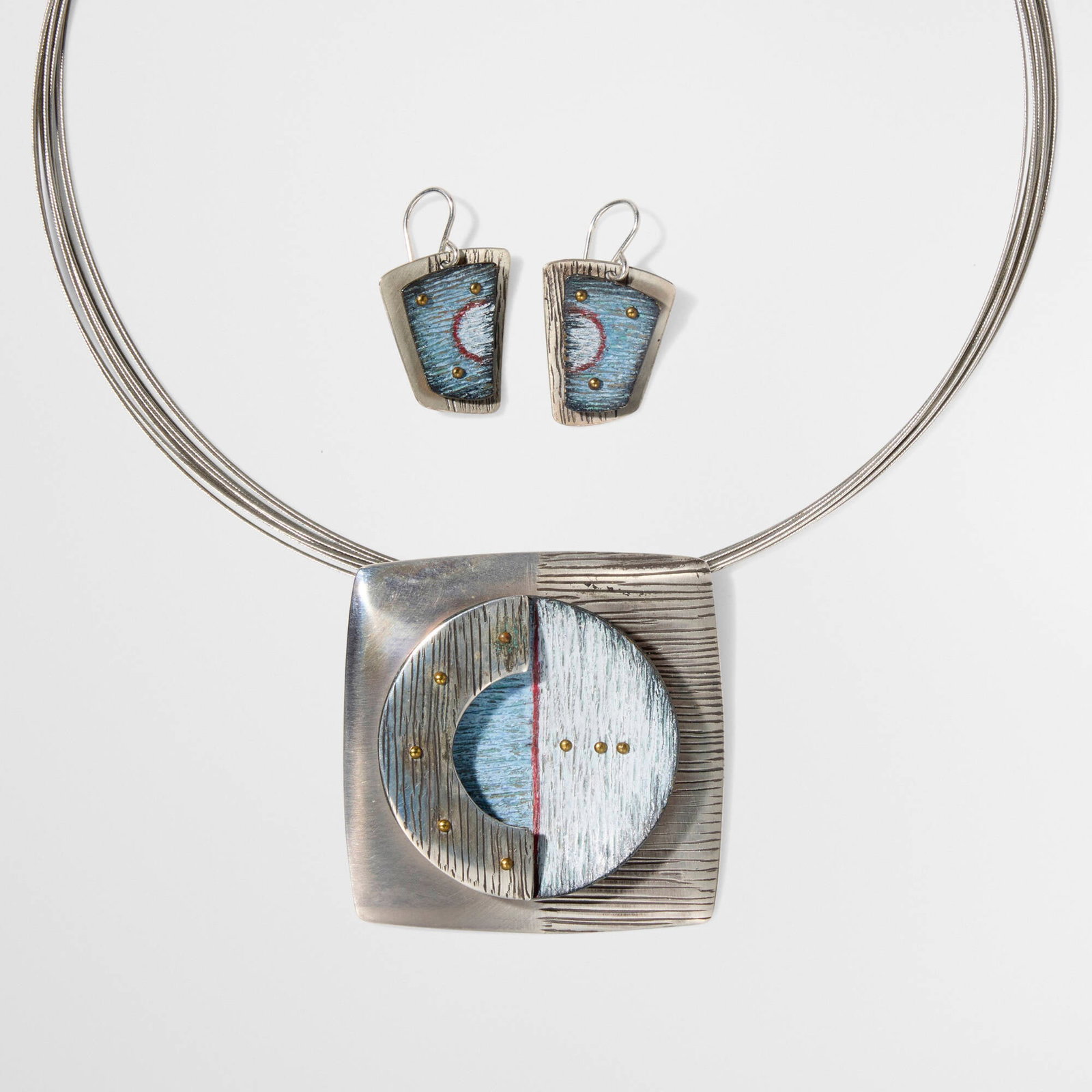 Deb Karash, Pendant necklace and earrings: Deb Karash Pendant necklace and earrings 2013 copper, Prismacolor, silver, steel necklace open: 2 h x 0.25 d x 16.25 l in (5 x 1 x 41 cm) necklace cord diameter: 5.25 dia in (13 cm) earrings: 1 h x