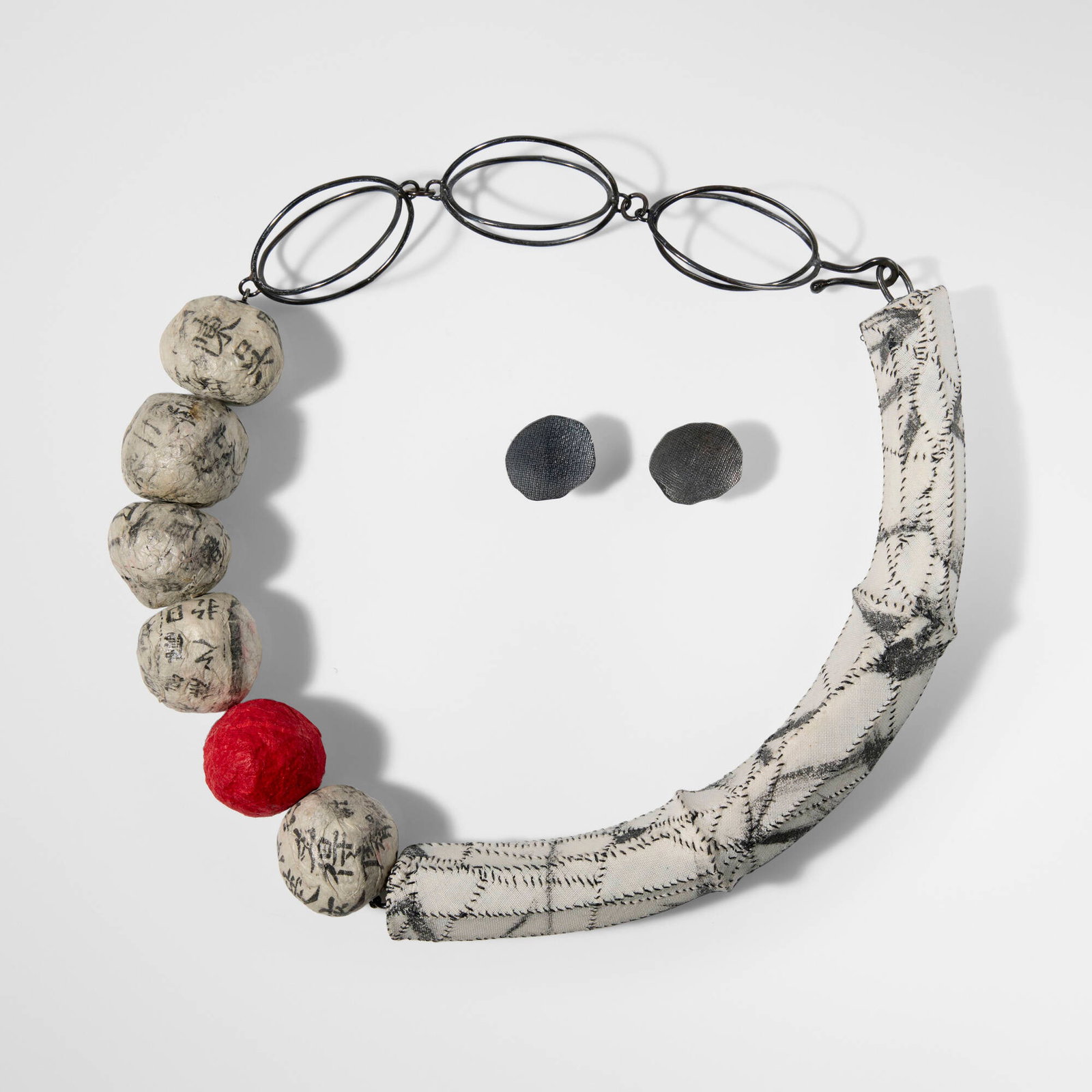 Myung Urso, Necklace and earrings: Myung Urso Necklace and earrings 2011 oxidized silver, hanji paper, textile necklace: 8.5 h x 7.5 w x 1 d in (22 x 19 x 3 cm) earrings: 0.875 h x 0.75 w in (2 x 2 cm) Inscribed Korean characters