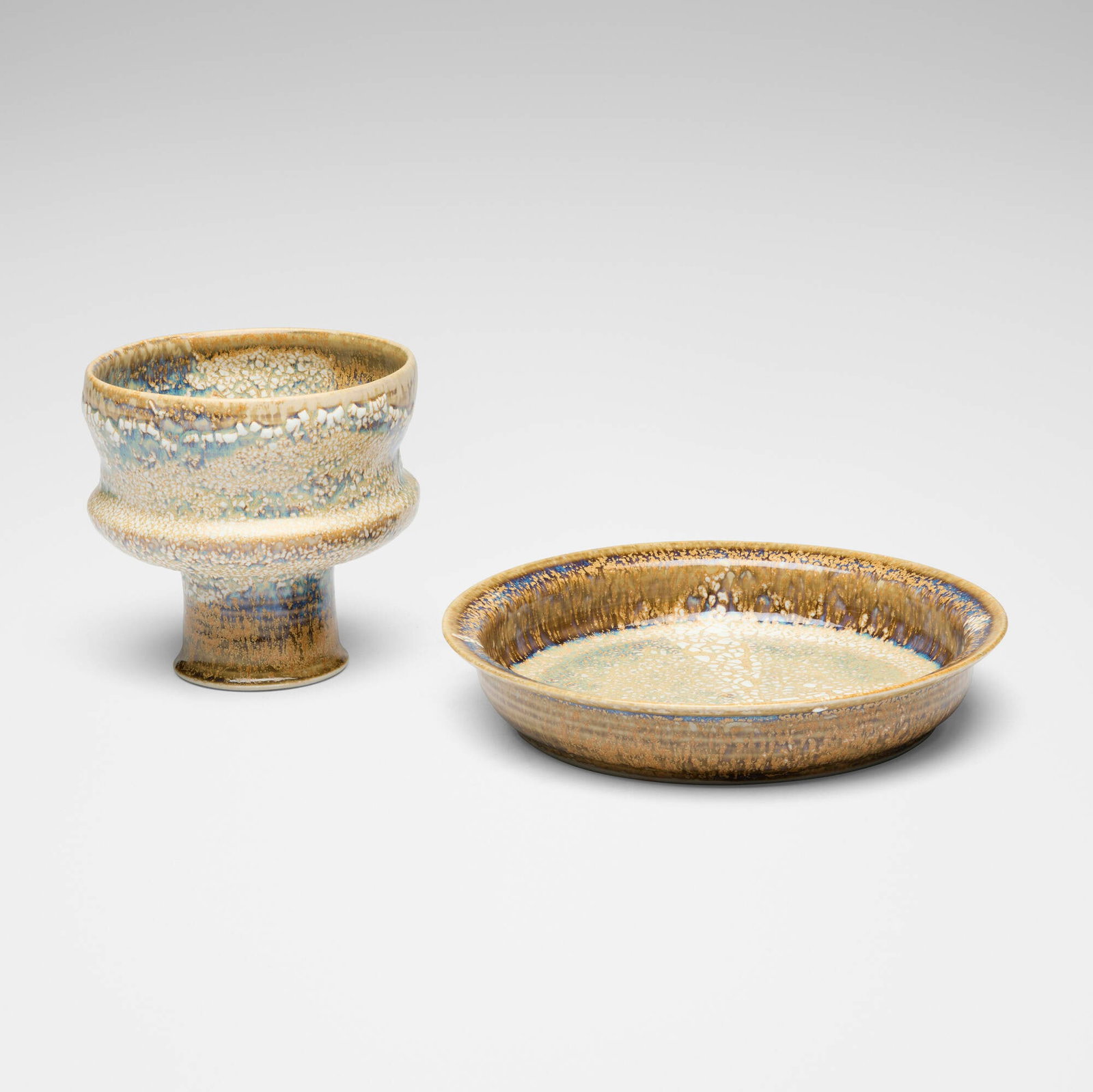 Brother Thomas Bezanson, Chalice and plate: Brother Thomas Bezanson Chalice and plate after 1985 kairagi-glazed porcelain 5 h x 5.25 dia in (13 x 13 cm) 1.5 h x 8.5 dia in (4 x 22 cm) Glazed ichthys symbol to underside of each example. 