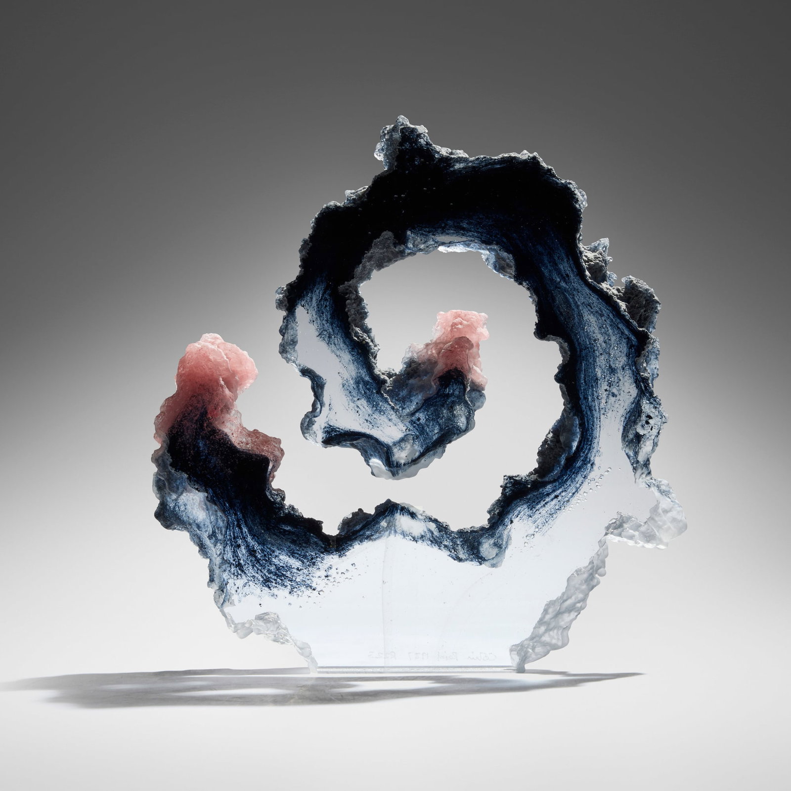 Colin Reid, R223 (Spiral): Colin Reid R223 (Spiral) 1987cast and polished optical glass 10.25 h x 10 w x 1.25 d in (26 x 25 x 3 cm) Etched signature, date, and title to lower edge 'Colin Reid 1987 R223'.