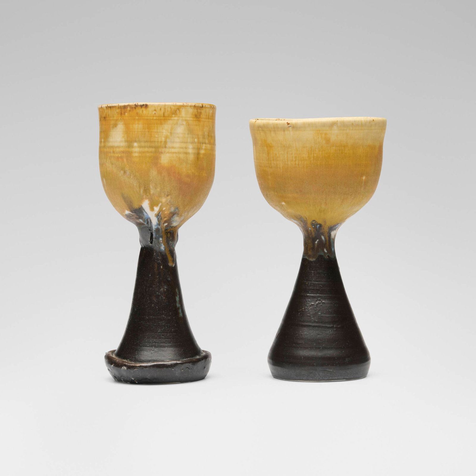 Toshiko Takaezu, Goblets (two works) (with rattle): Toshiko Takaezu Goblets (two works) (with rattle) c. 1985glazed porcelain 7.5 h x 3.125 dia in (19 x 8 cm) 7 h x 3.75 dia in (18 x 10 cm) Incised signature to underside of each example 'TT'