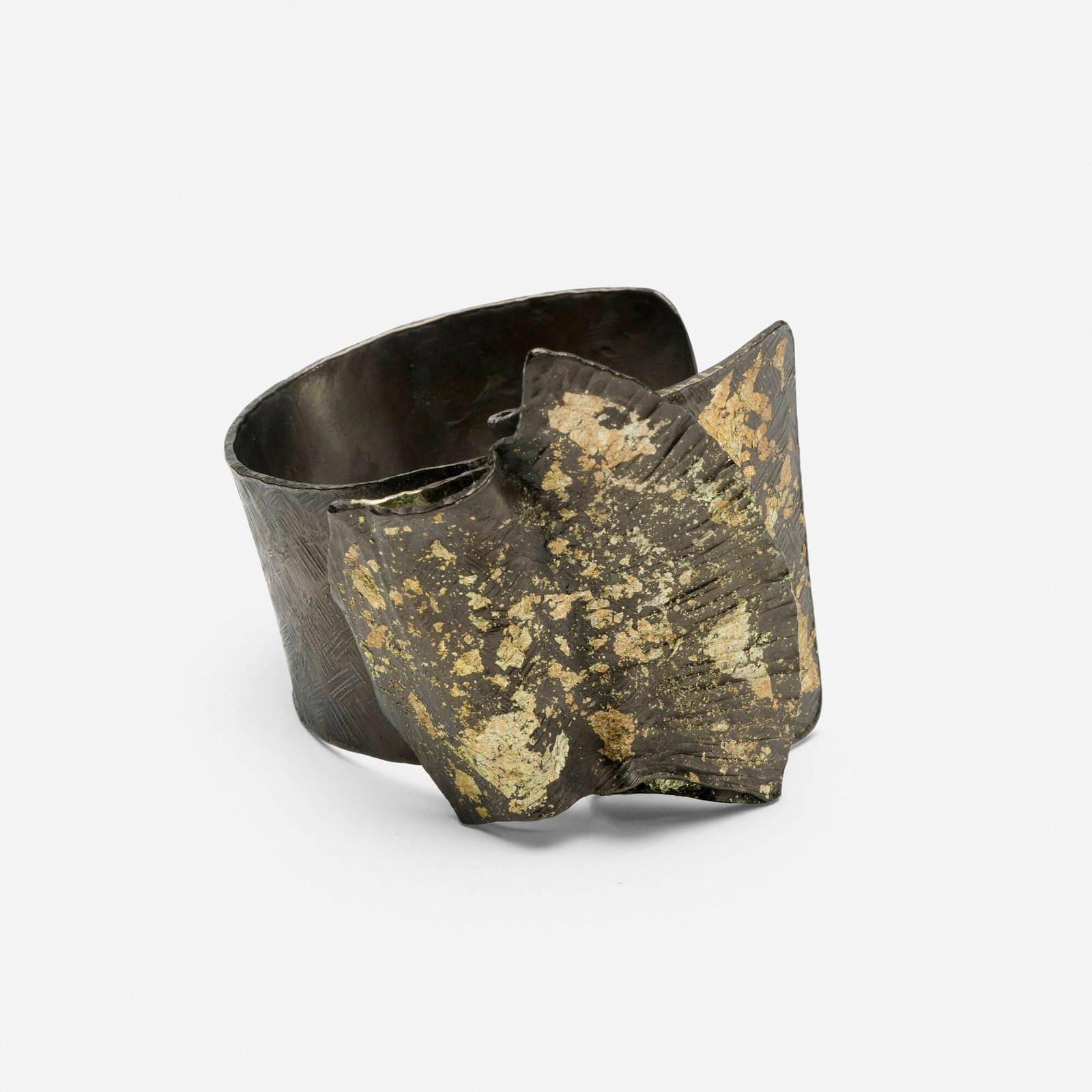 Tomoyo Hiraiwa, Organic Wave cuff: Tomoyo Hiraiwa Organic Wave cuff c. 2010patinated steel, gold leaf 2.375 h x 2.625 w x 2.625 d in (6 x 7 x 7 cm) Incised signature to underside 'Tomoyo H'. Provenance: