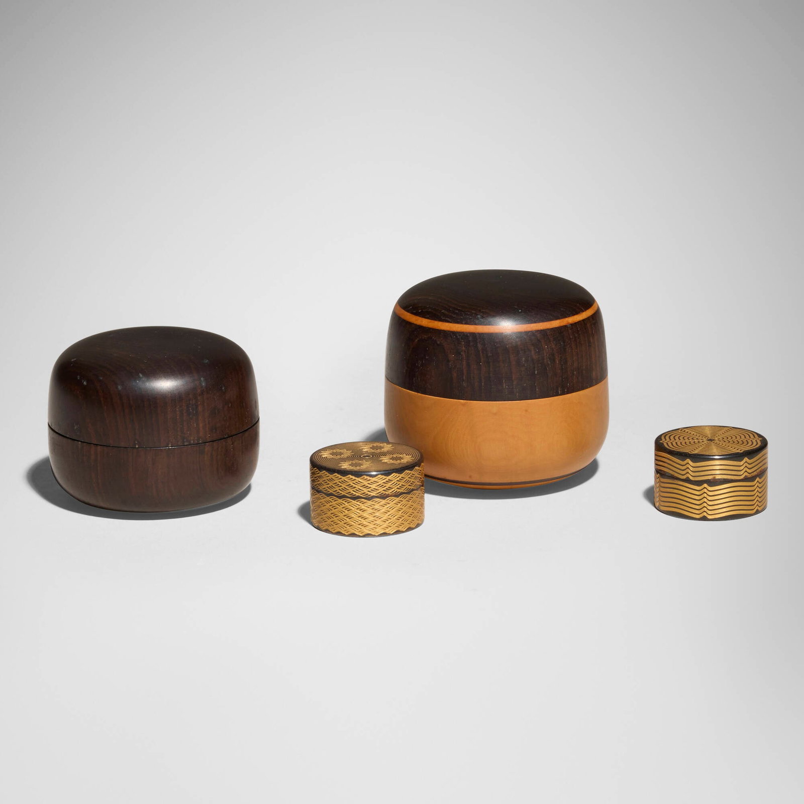 Dale Chase, Collection of four small boxes: Dale Chase Collection of four small boxes c. 1995boxwood, African blackwood, metal tallest: 2.5 h x 2.75 dia in (6 x 7 cm) shortest: 0.875 h x 1.375 dia in (2 x 3 cm) 1.875 h x 2.5 dia in (5 x