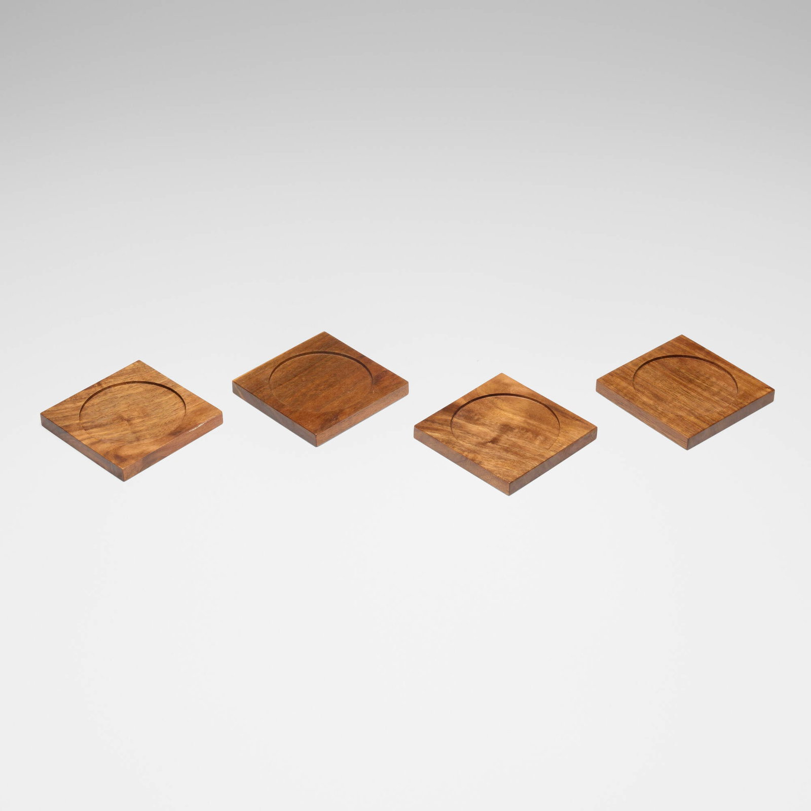 Mira Nakashima, Coasters, set of four: Mira Nakashima Coasters, set of four Nakashima Studioc. 2020American black walnut each: 0.375 h x 4 w x 4 d in (1 x 10 x 10 cm) Incised signature to side of each example 'Mira Nakashima'