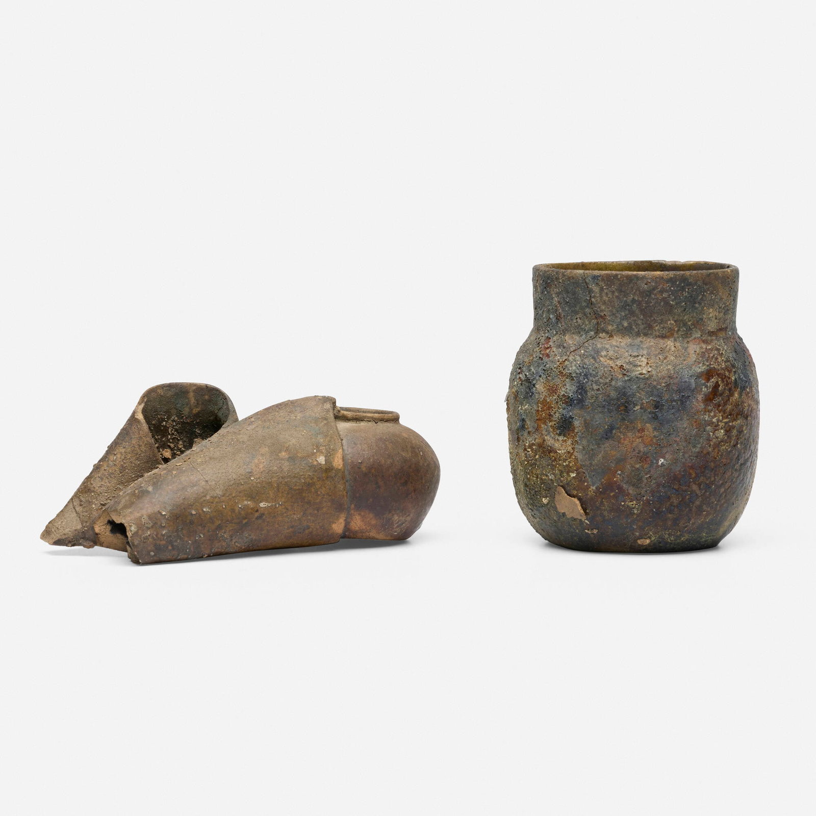 George E. Ohr, Burnt Babies, set of two: George E. Ohr Burnt Babies, set of two USA, 1892-94 glazed earthenware 3.5 h x 3.25 dia in (9 x 8 cm) 2 h x 5.25 w x 2.5 d in (5 x 13 x 6 cm) George Ohr's pottery burned to the ground on October