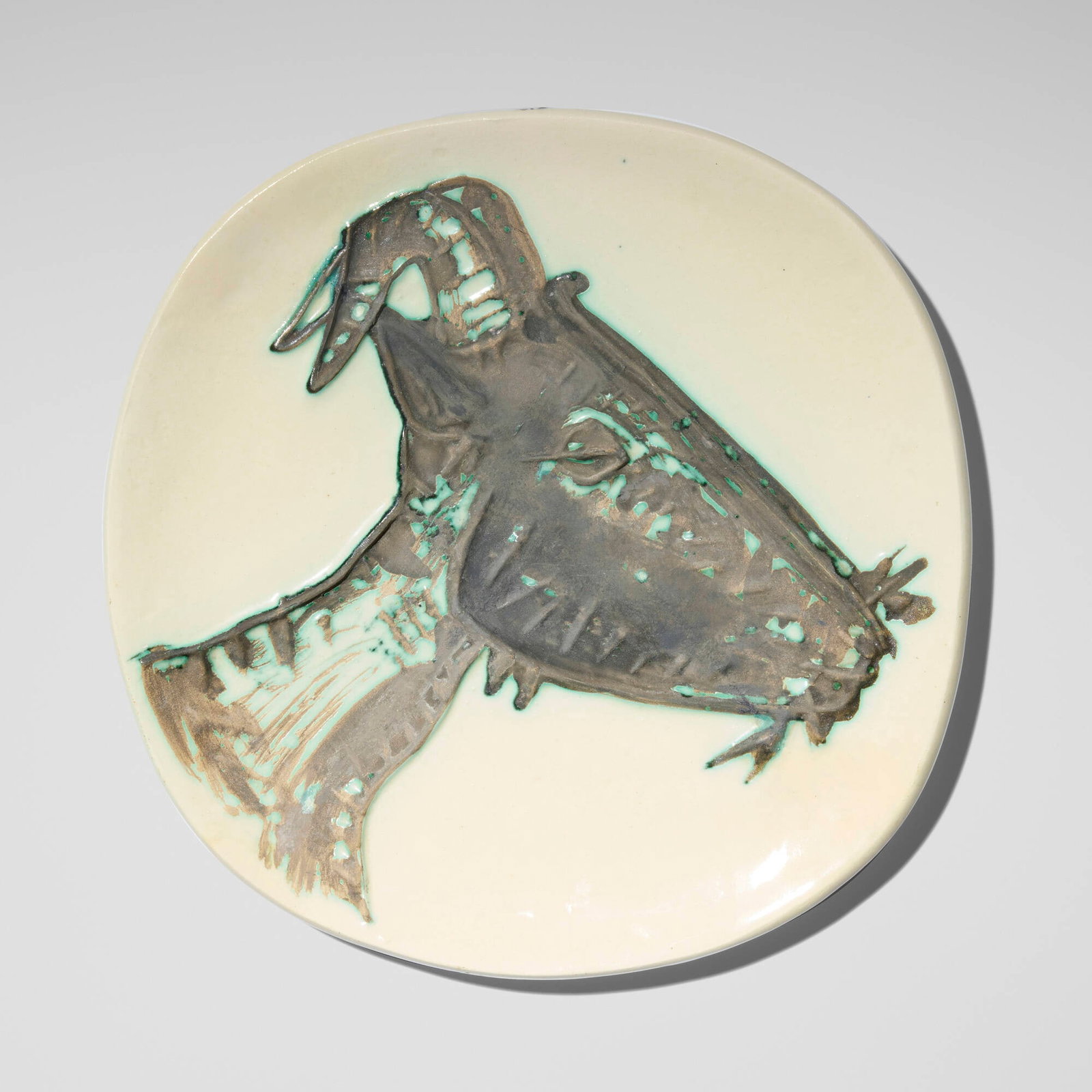 Pablo Picasso, Tete de chevre de profil: Pablo Picasso Tete de chevre de profil 1950 glazed earthenware with oxidized paraffin decoration 1 h x 10.25 dia in (3 x 26 cm) Impressed studio marks to verso 'Madoura Plein Feu Empreinte Orig