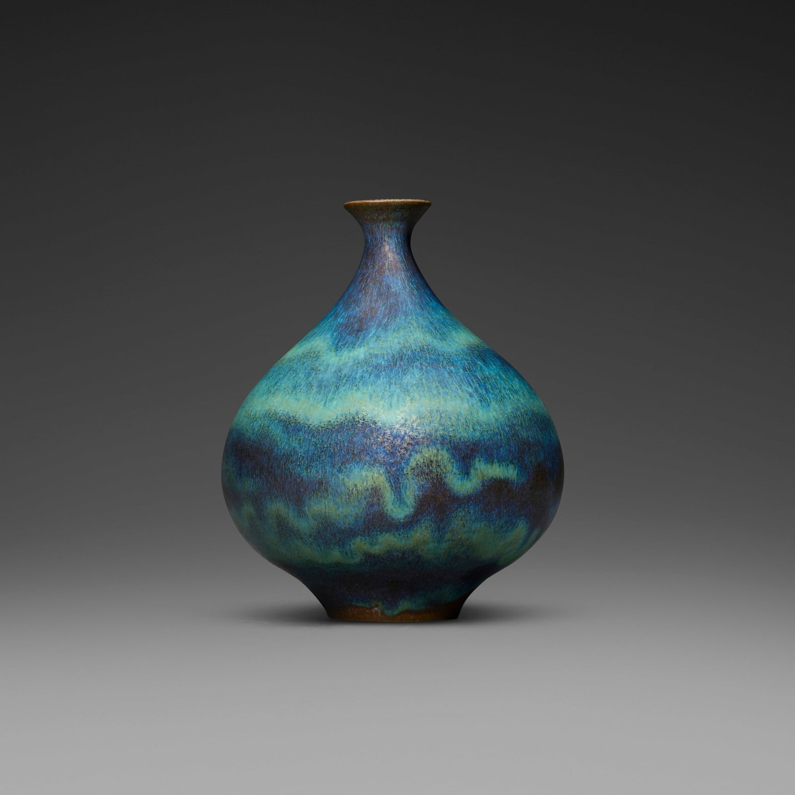 Gertrud and Otto Natzler, Round bottle with lip: Gertrud and Otto Natzler Round bottle with lip 1964 earthenware with Green Crystalline glaze 6.125 h x 5 dia in (16 x 13 cm) Signed to underside 'Natzler' with archive number 'N058' and red